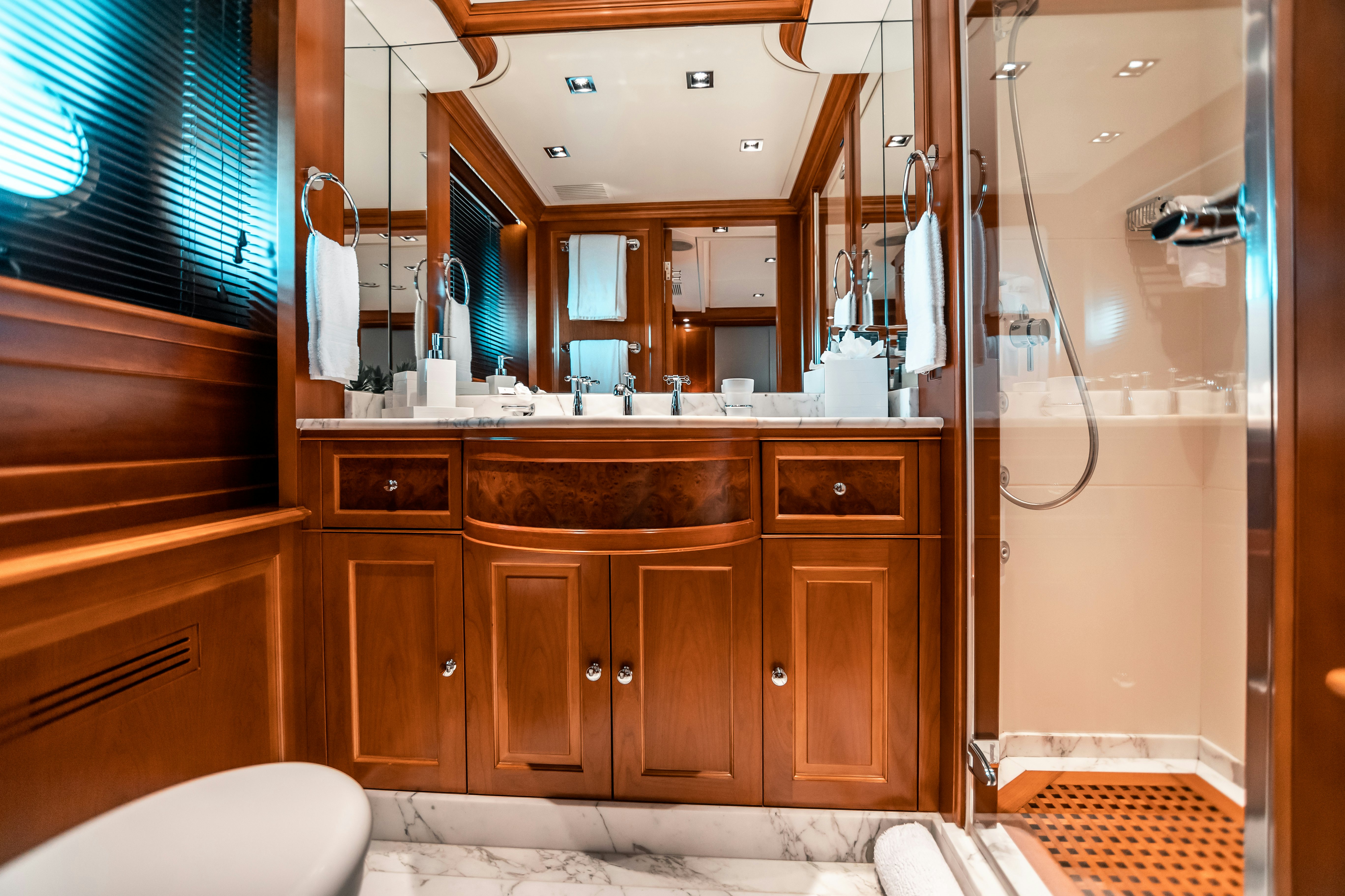 a bathroom with a large mirror aboard ARTHUR’S WAY Yacht for Charter