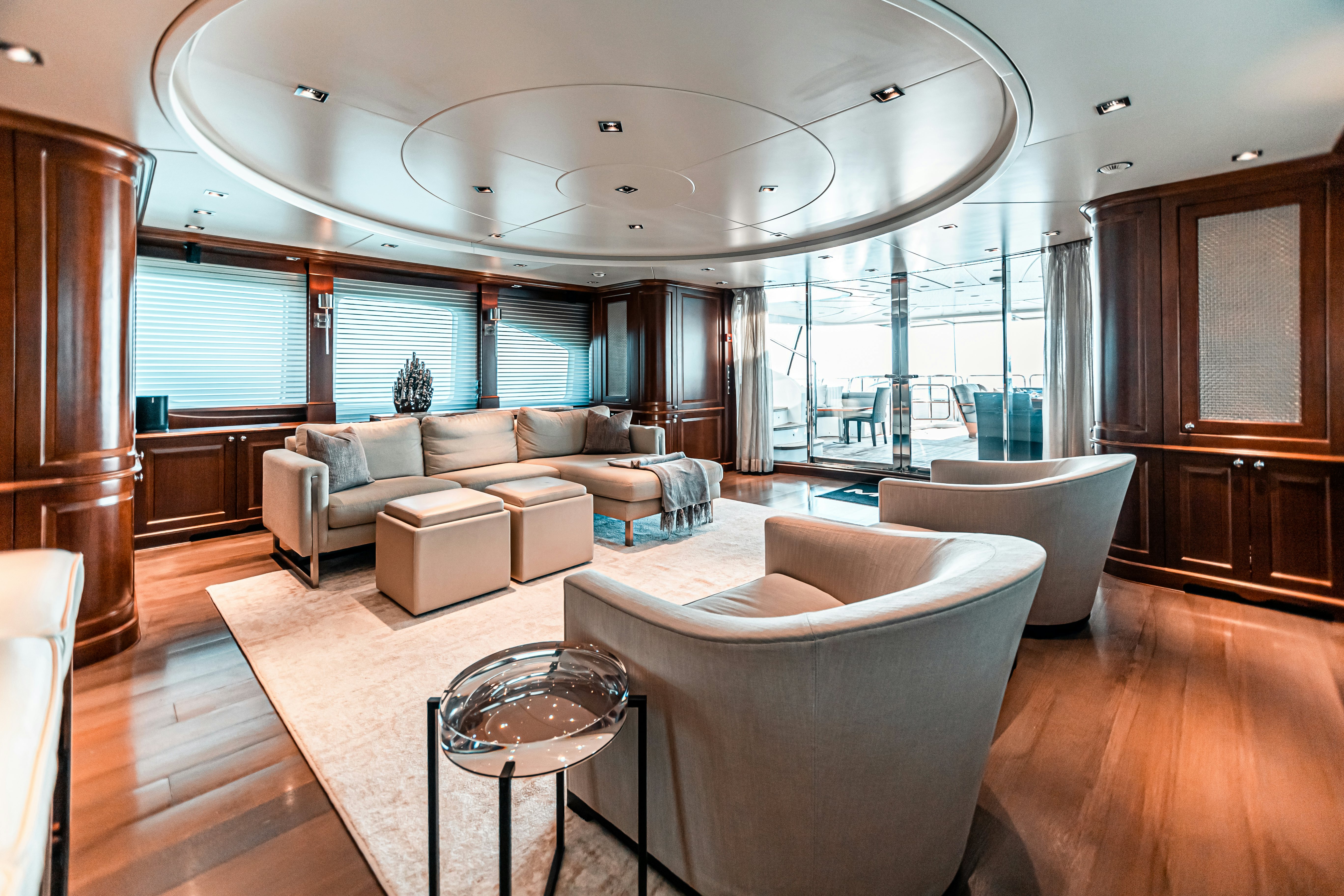 a living room with a large glass ceiling aboard ARTHUR’S WAY Yacht for Charter