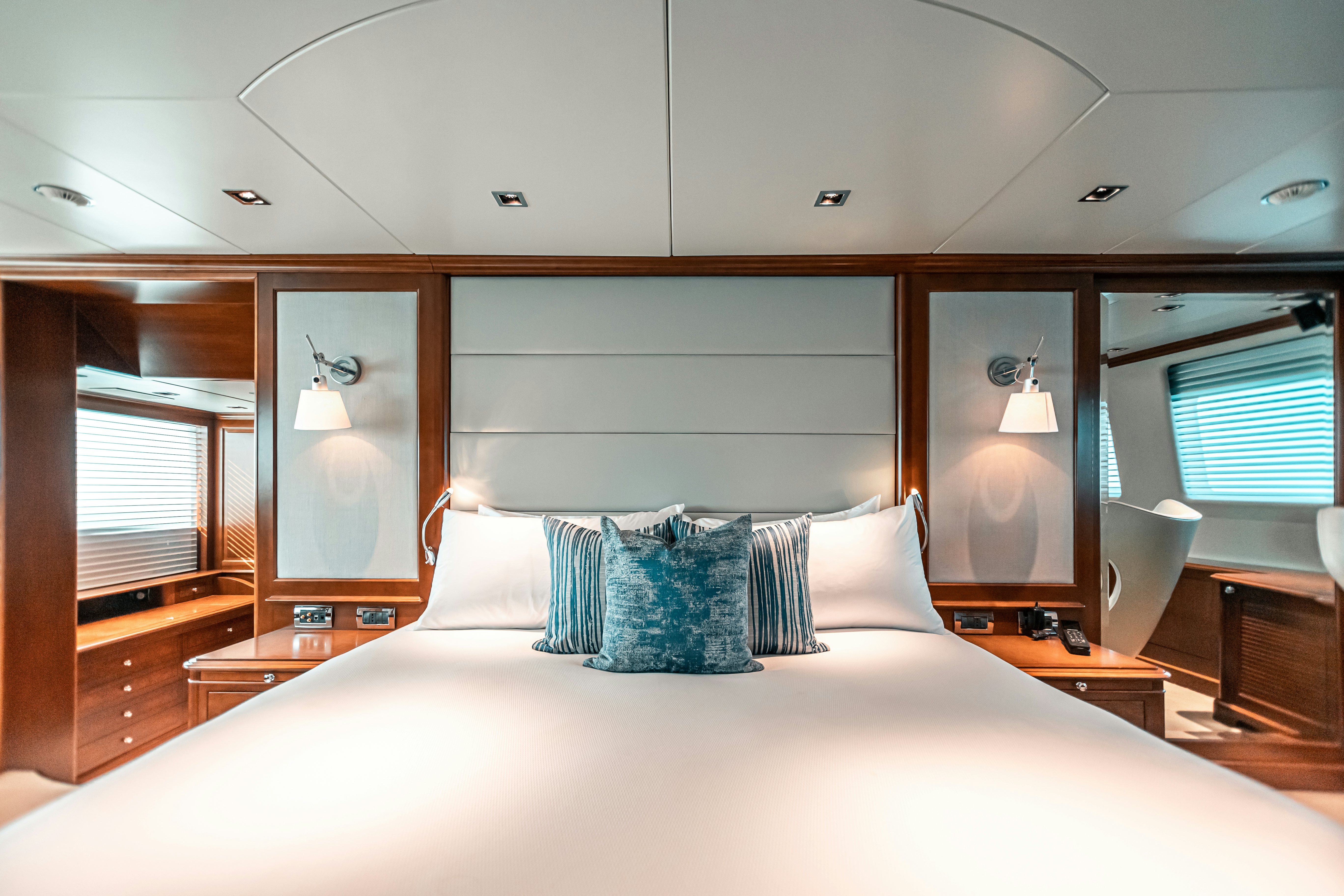 a bed with pillows and pillows aboard ARTHUR’S WAY Yacht for Charter