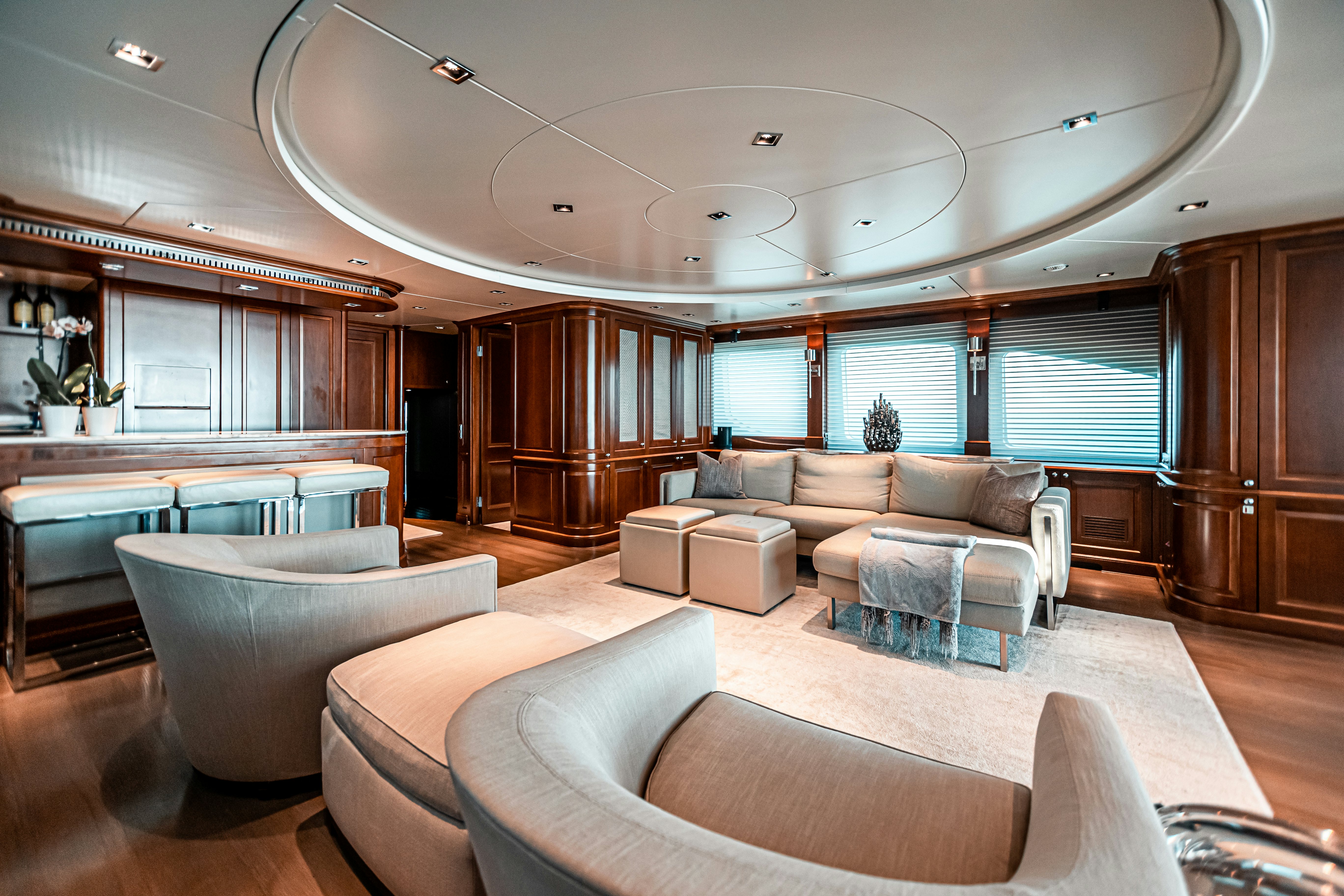 a living room with a large glass window aboard ARTHUR’S WAY Yacht for Charter