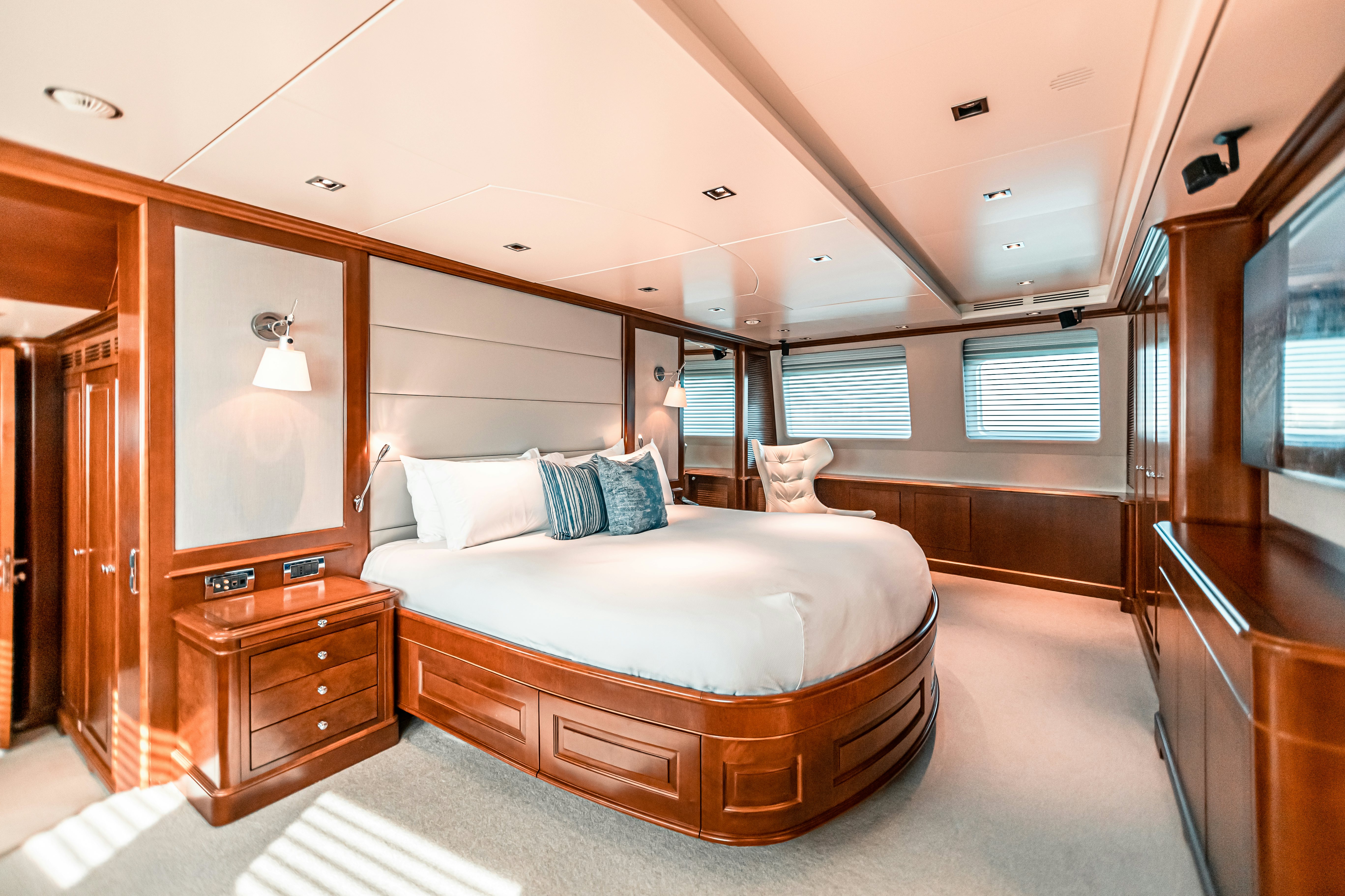 a large bedroom with a large bed aboard ARTHUR’S WAY Yacht for Charter
