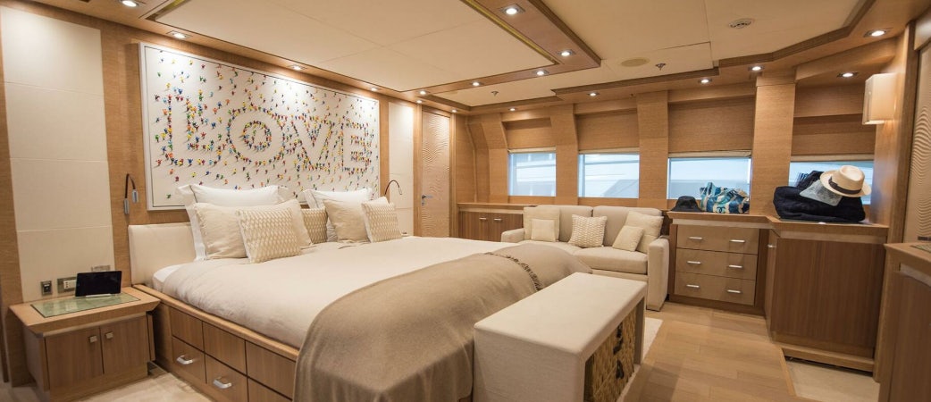 a room with a bed and a couch aboard NORMA JEAN Yacht for Charter
