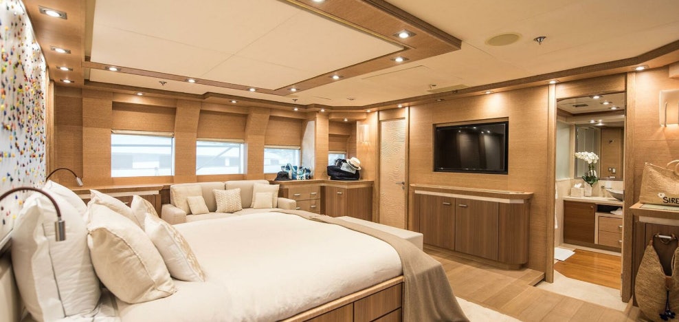 a room with a bed and a tv aboard NORMA JEAN Yacht for Charter