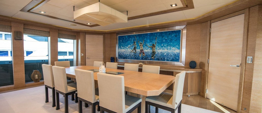 a conference room with tables and chairs aboard NORMA JEAN Yacht for Charter