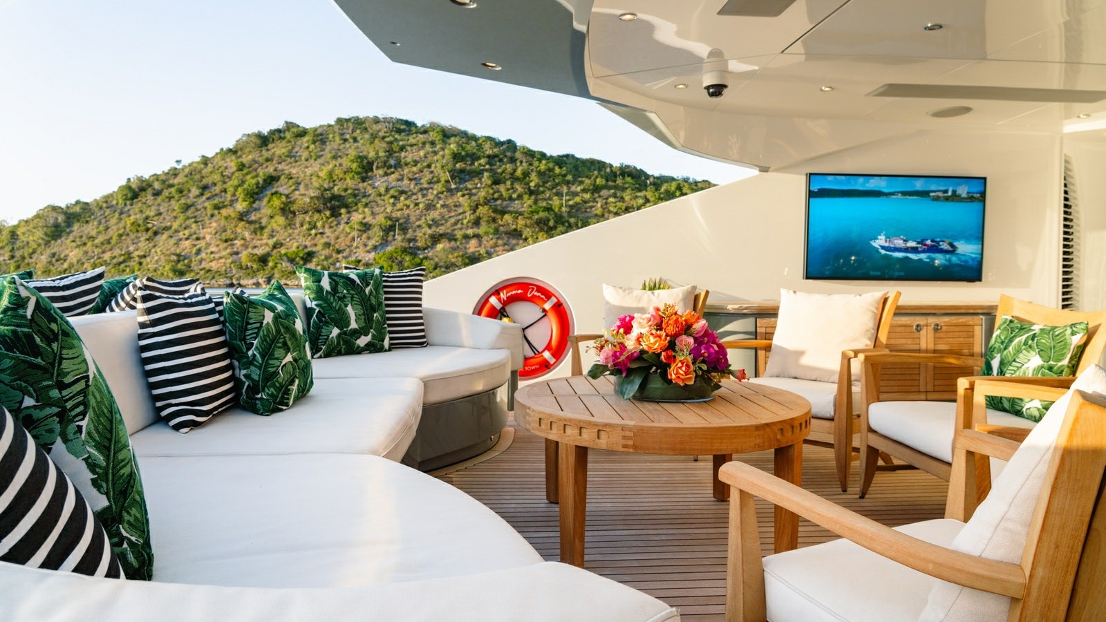 a living room with a large screen aboard NORMA JEAN Yacht for Charter