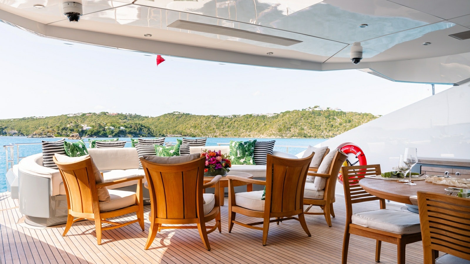 a patio with tables and chairs aboard NORMA JEAN Yacht for Charter