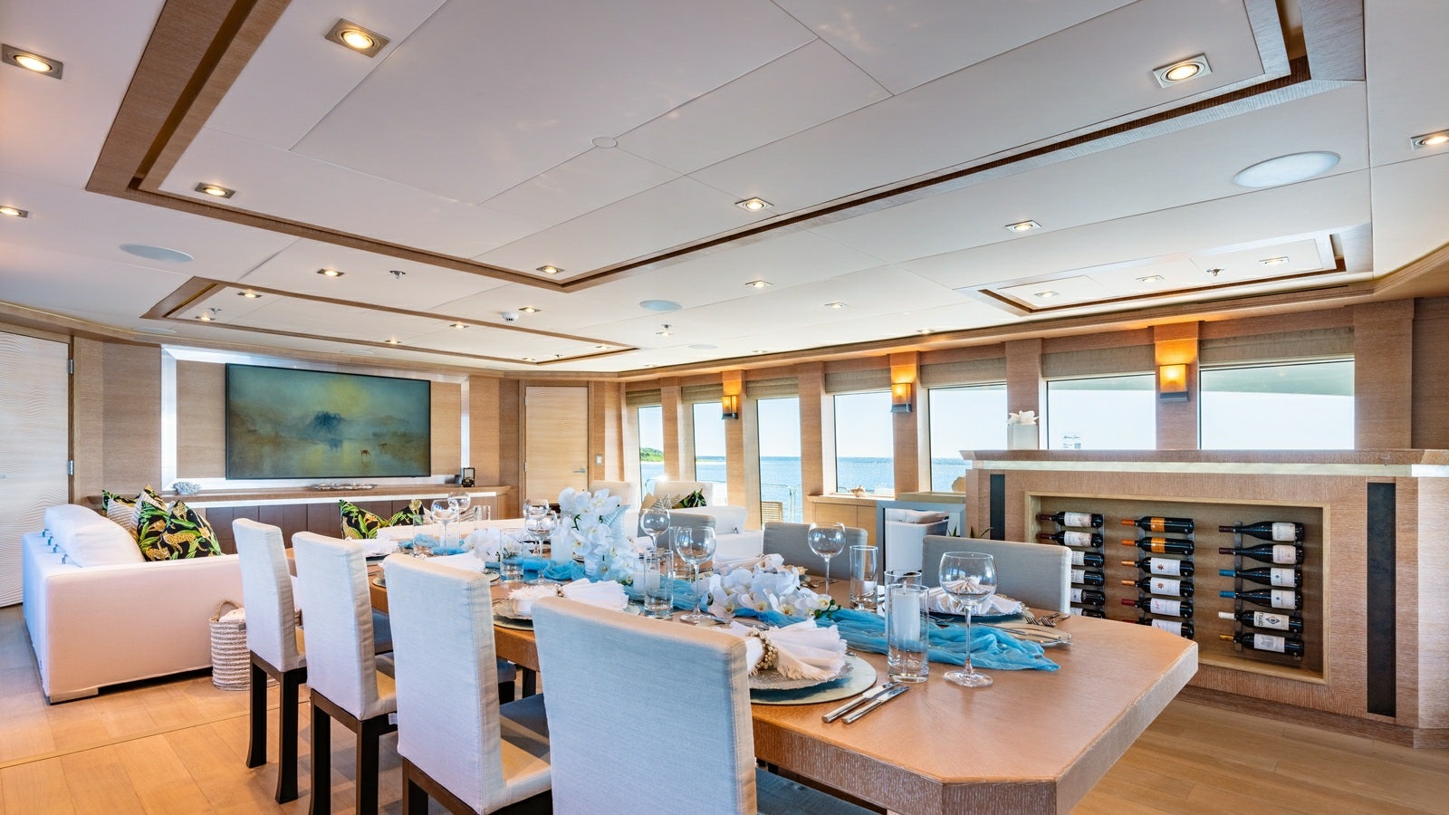 a large room with a table and chairs aboard NORMA JEAN Yacht for Charter