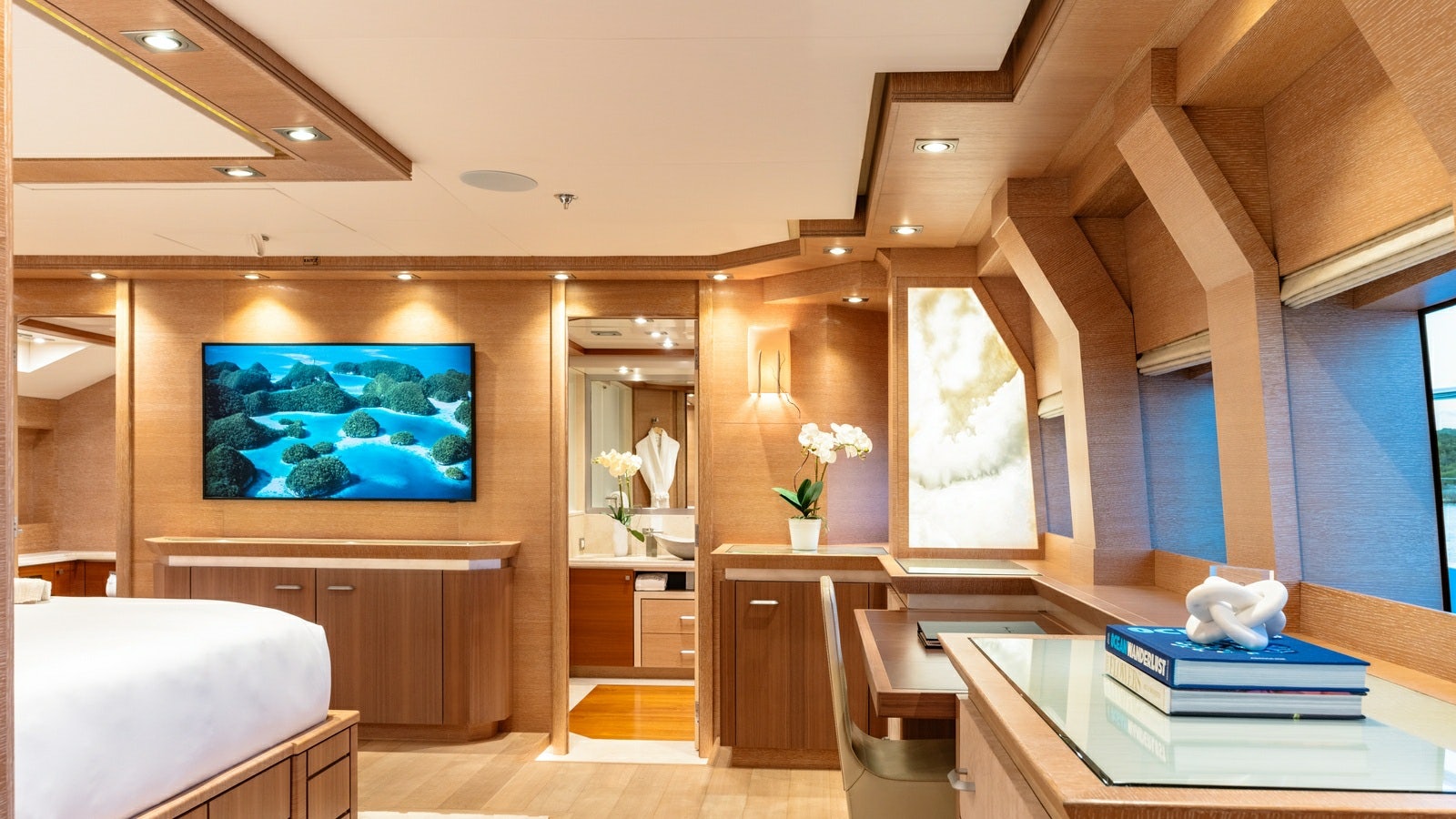 a room with a tv and a bed aboard NORMA JEAN Yacht for Charter