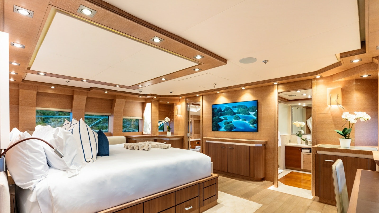 a room with a bed and a tv aboard NORMA JEAN Yacht for Charter