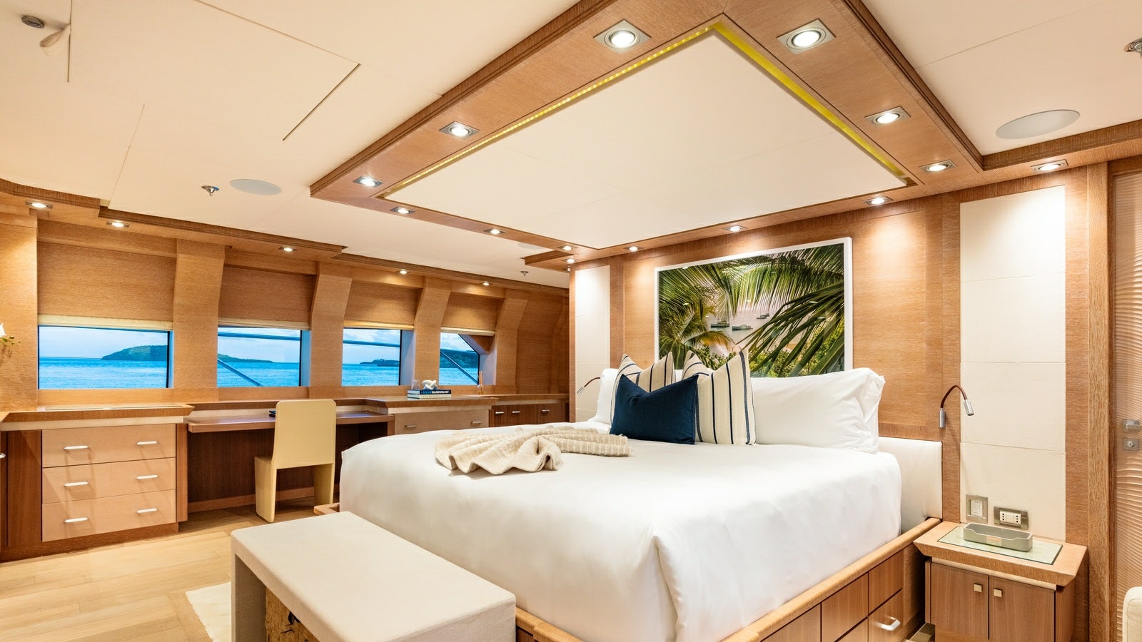 a room with a bed and a desk aboard NORMA JEAN Yacht for Charter