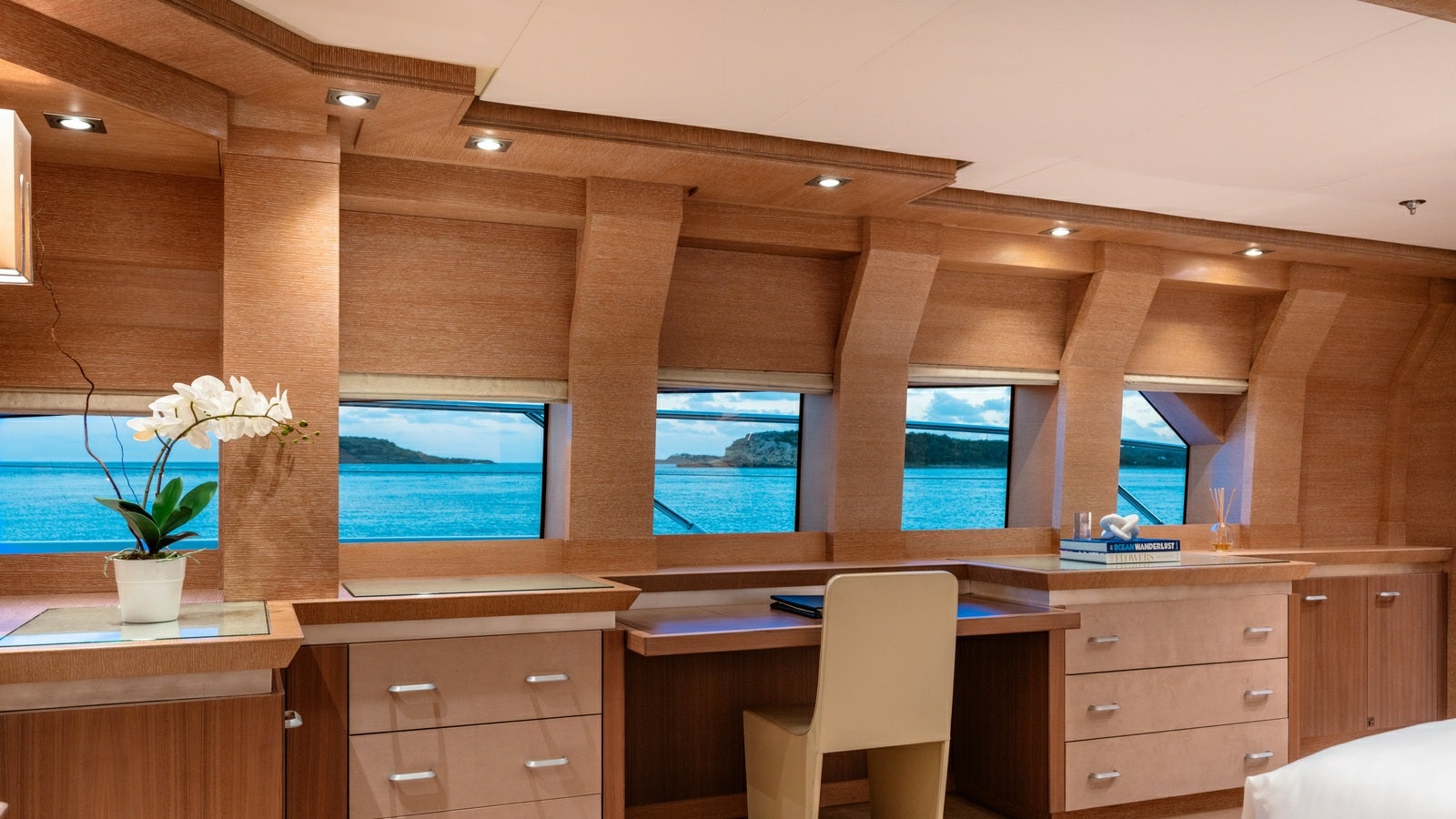 a room with a desk and a tv aboard NORMA JEAN Yacht for Charter
