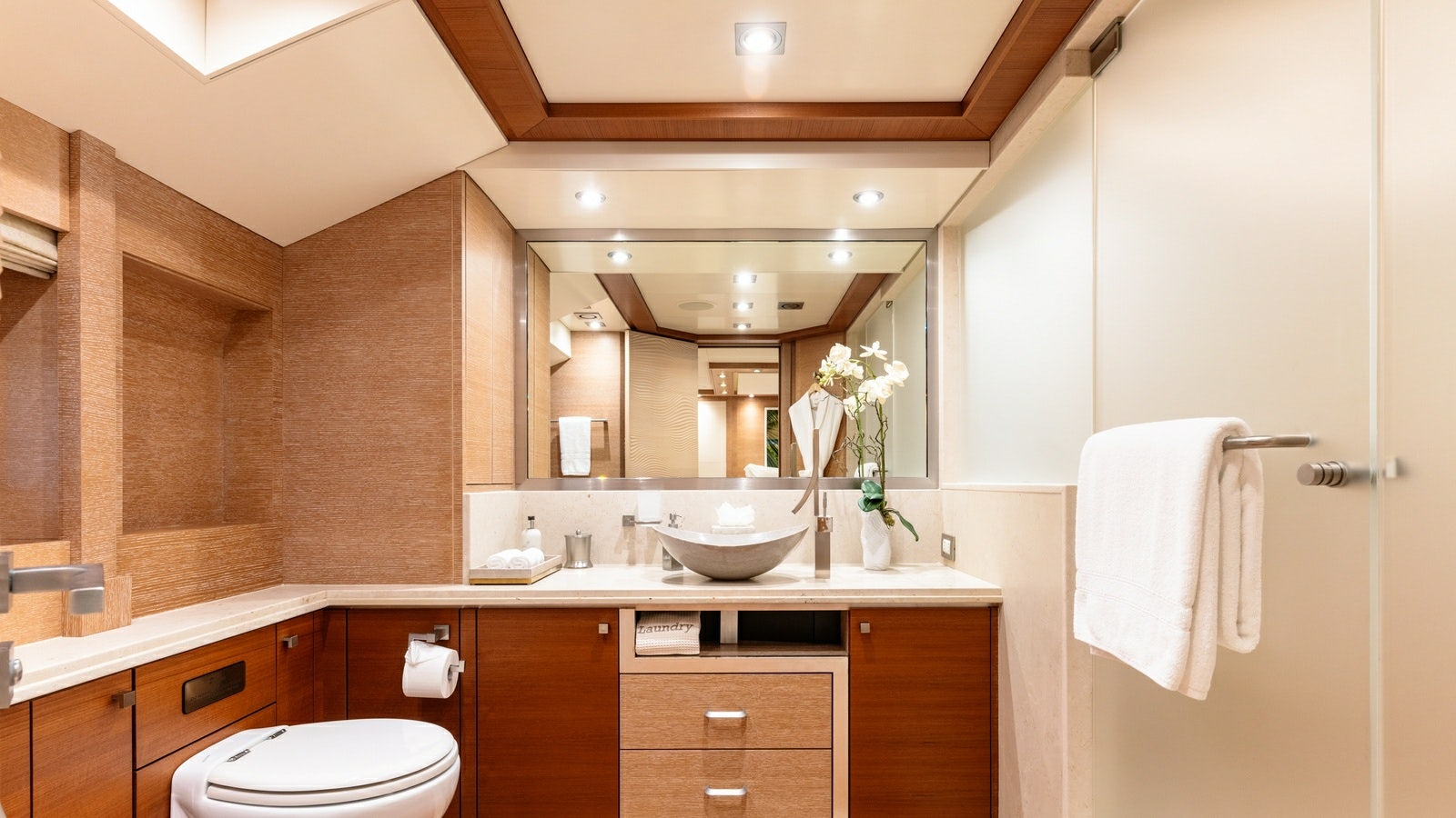 a bathroom with a large mirror aboard NORMA JEAN Yacht for Charter