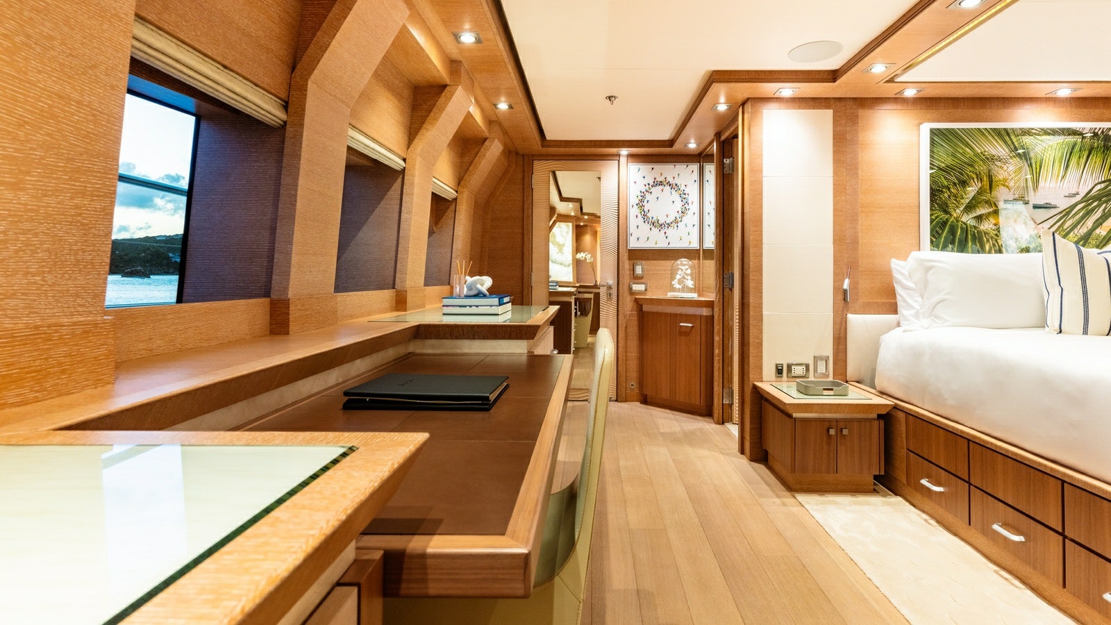 a room with a bed and a desk aboard NORMA JEAN Yacht for Charter