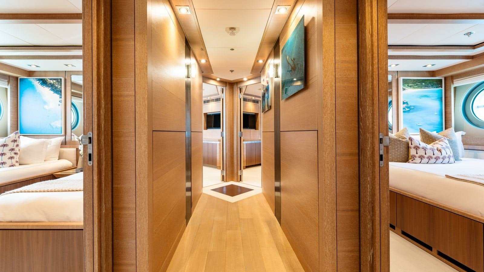 a room with a bed and a mirror aboard NORMA JEAN Yacht for Charter