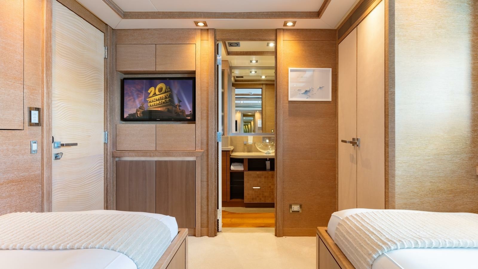 a hotel room with a tv on the wall aboard NORMA JEAN Yacht for Charter