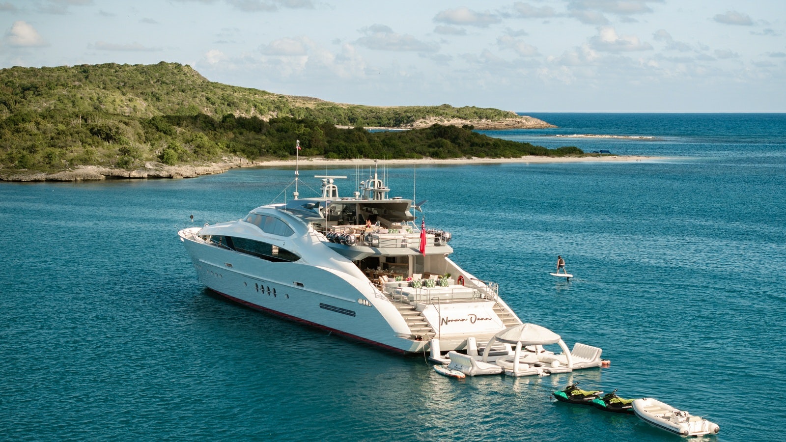 a large white yacht in the water aboard NORMA JEAN Yacht for Charter