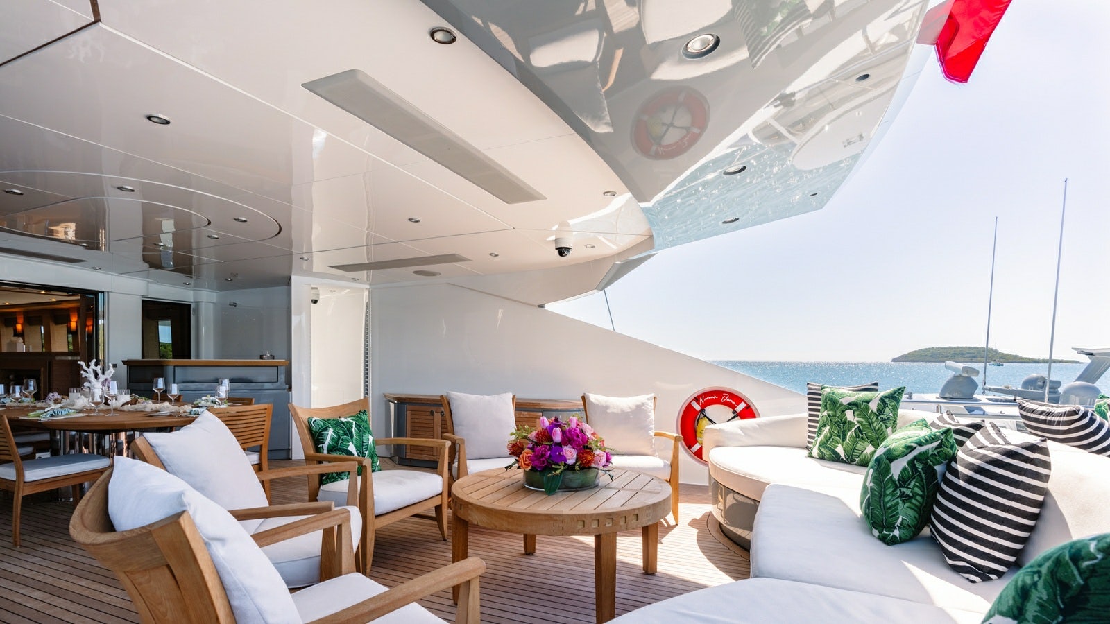 a room with a table and chairs aboard NORMA JEAN Yacht for Charter