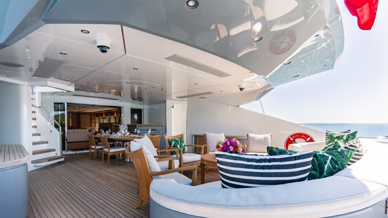 a room with a bed and chairs aboard NORMA JEAN Yacht for Charter