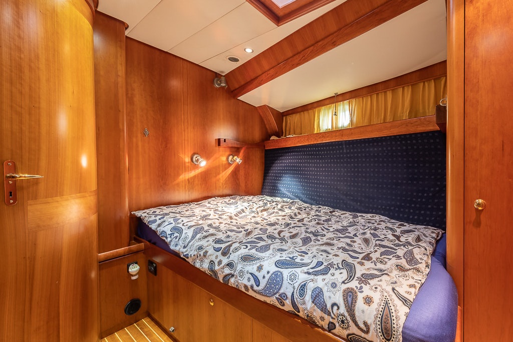 a bed in a room aboard JULIA Yacht for Sale