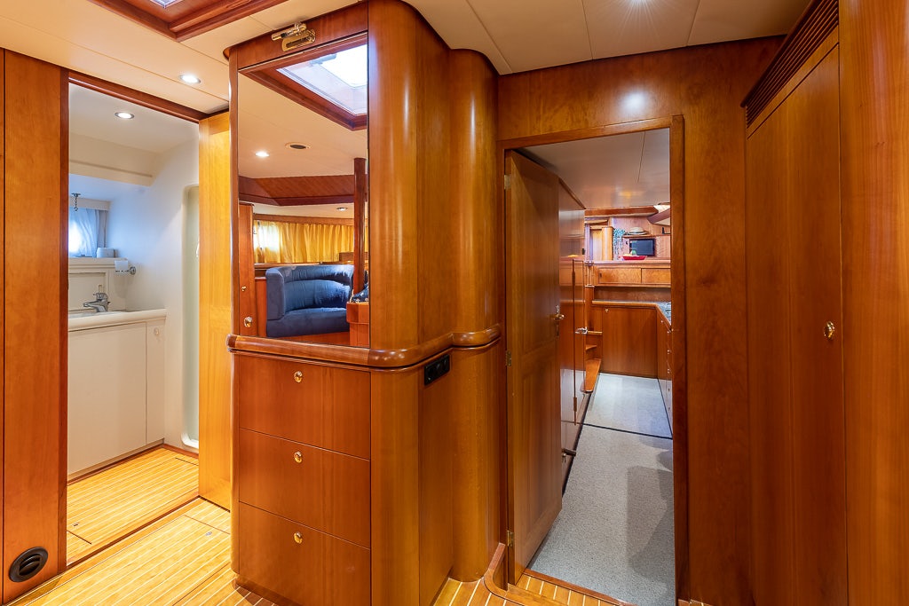 a room with a wood cabinet and a wood cabinet aboard JULIA Yacht for Sale