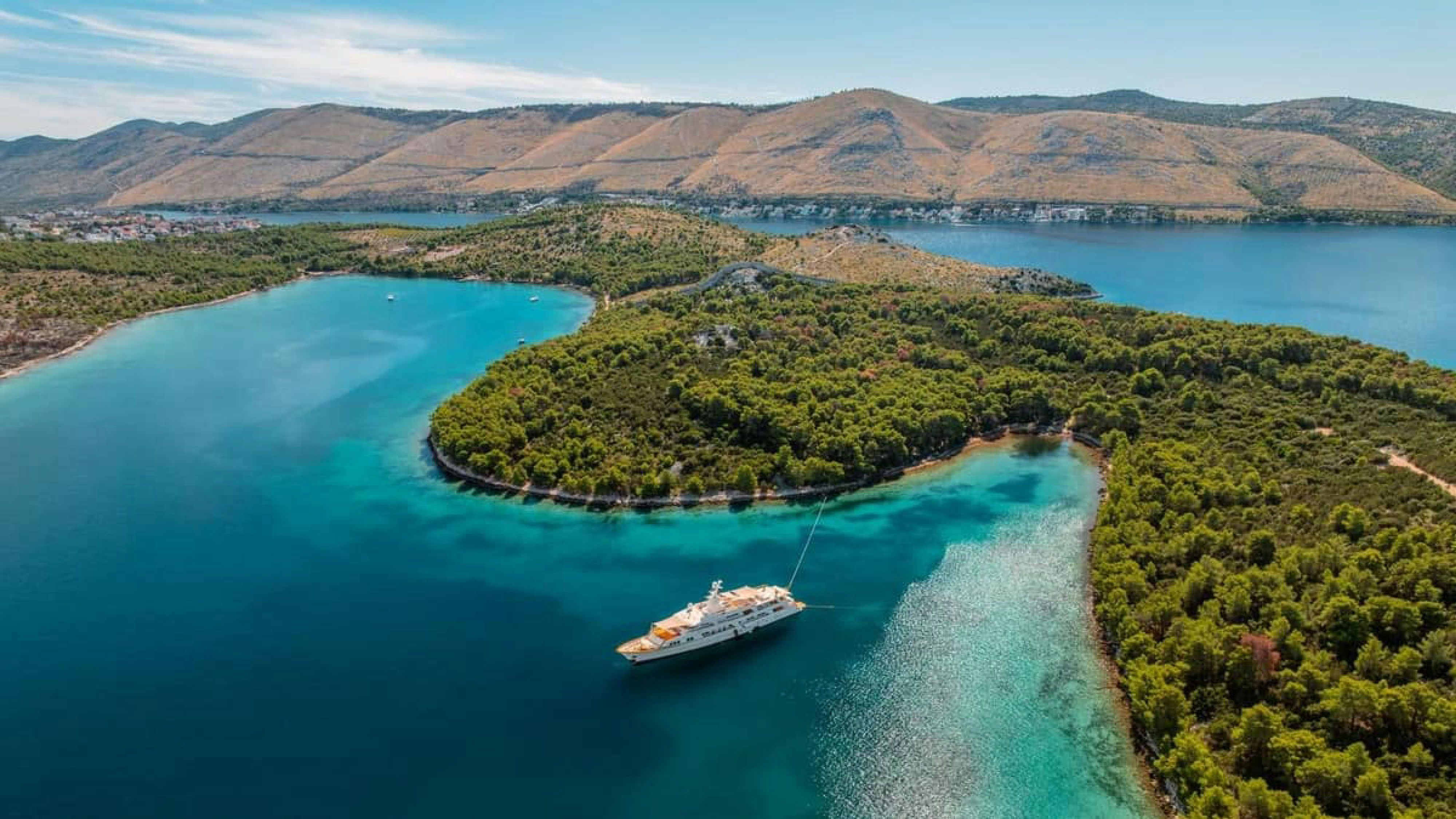 a boat sailing on a river aboard VICTORY Yacht for Charter