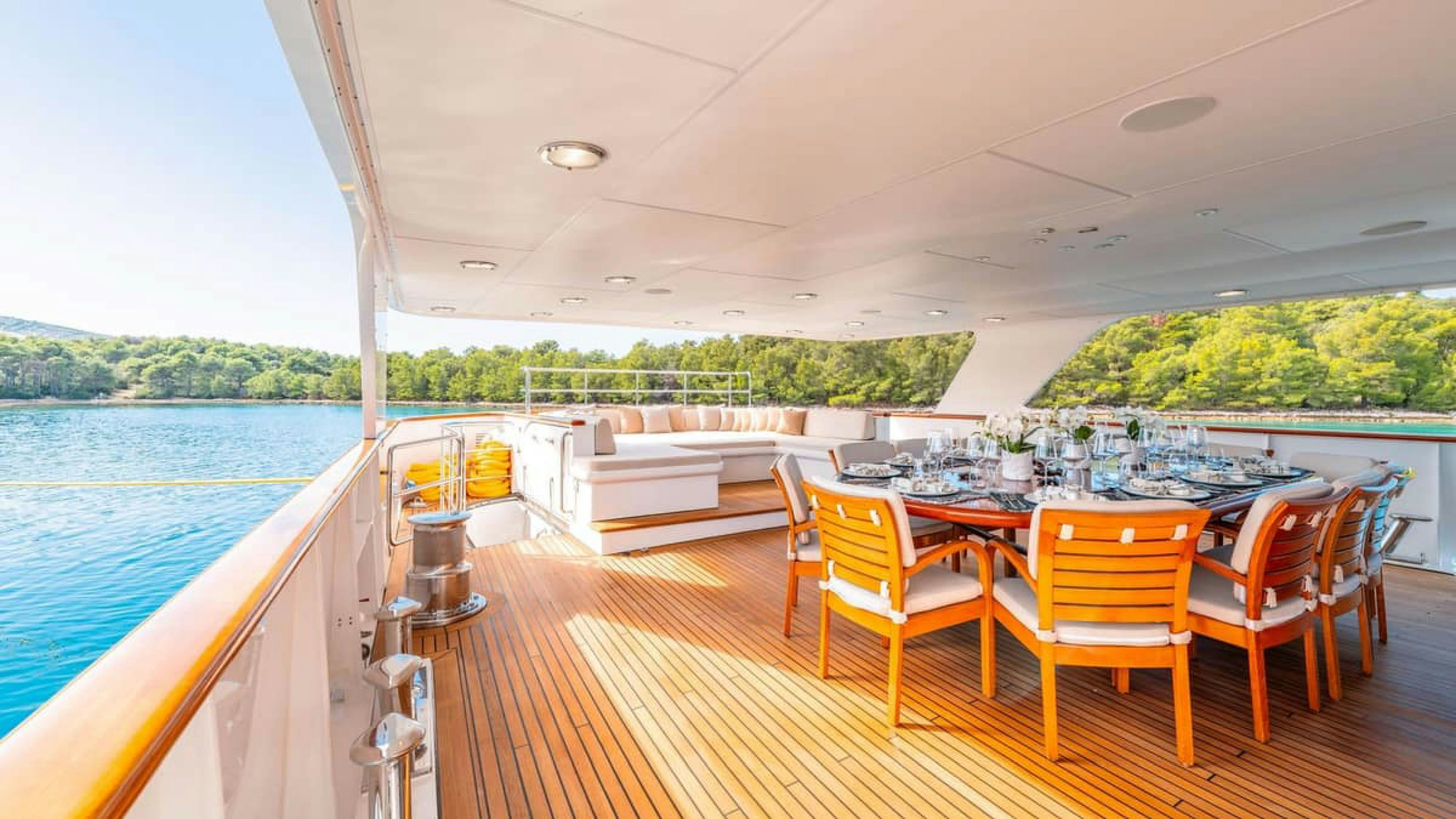 a table set for a meal on a boat aboard VICTORY Yacht for Charter