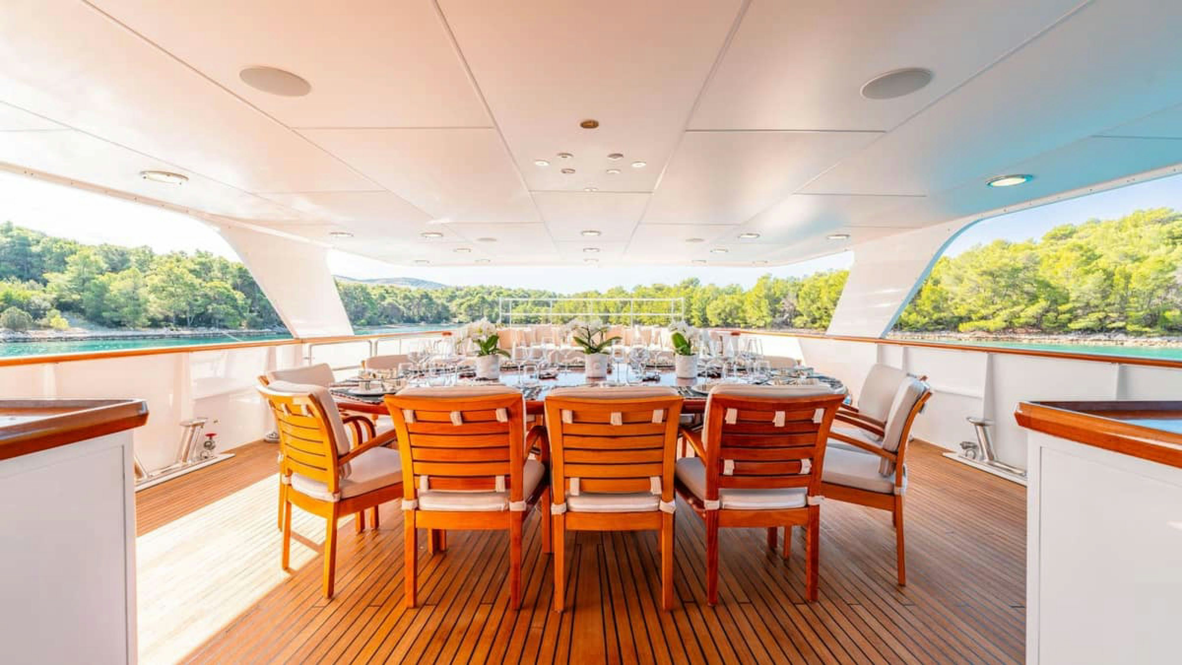 a room with a table and chairs aboard VICTORY Yacht for Charter