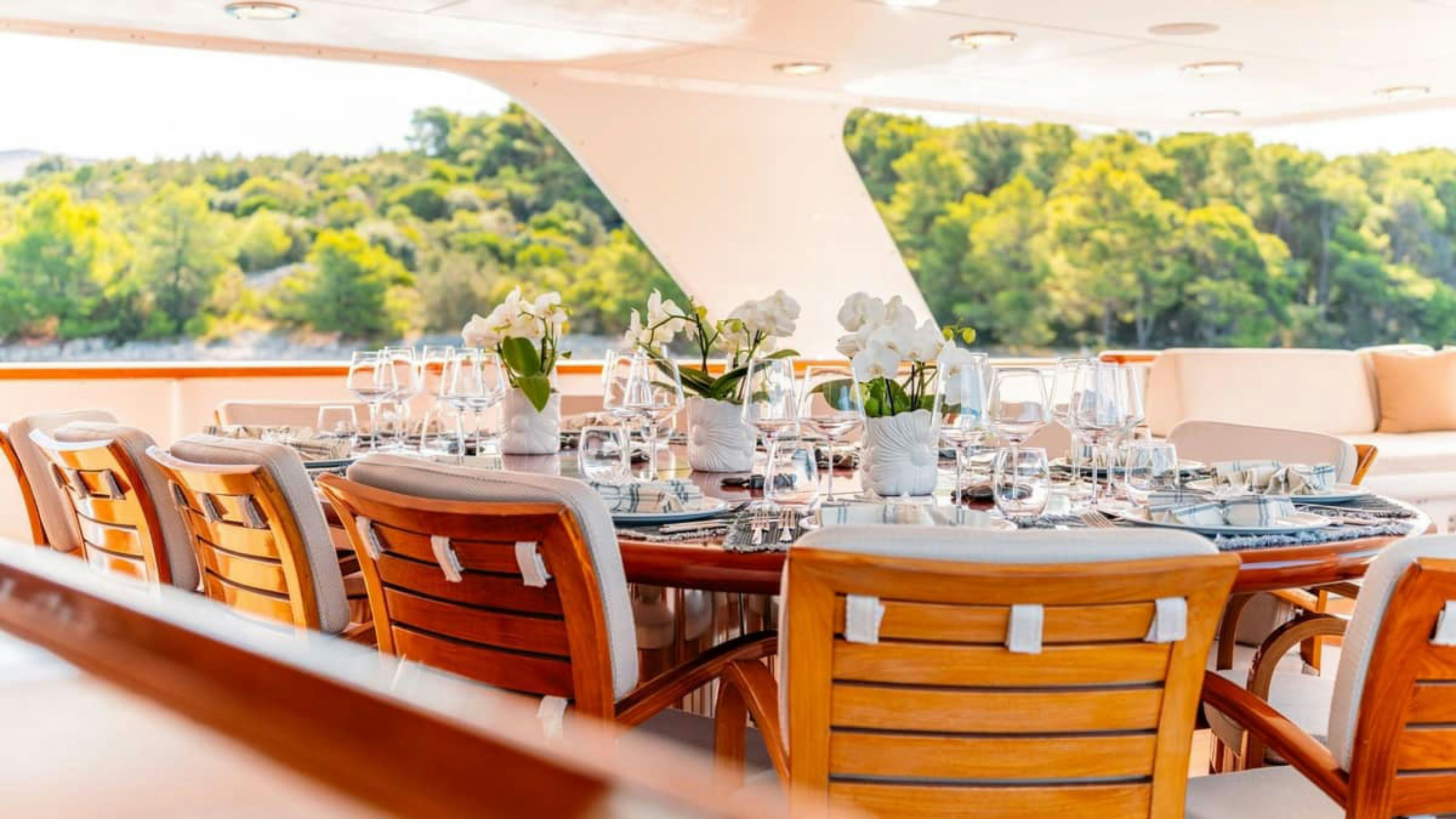 a table set for a wedding reception aboard VICTORY Yacht for Charter