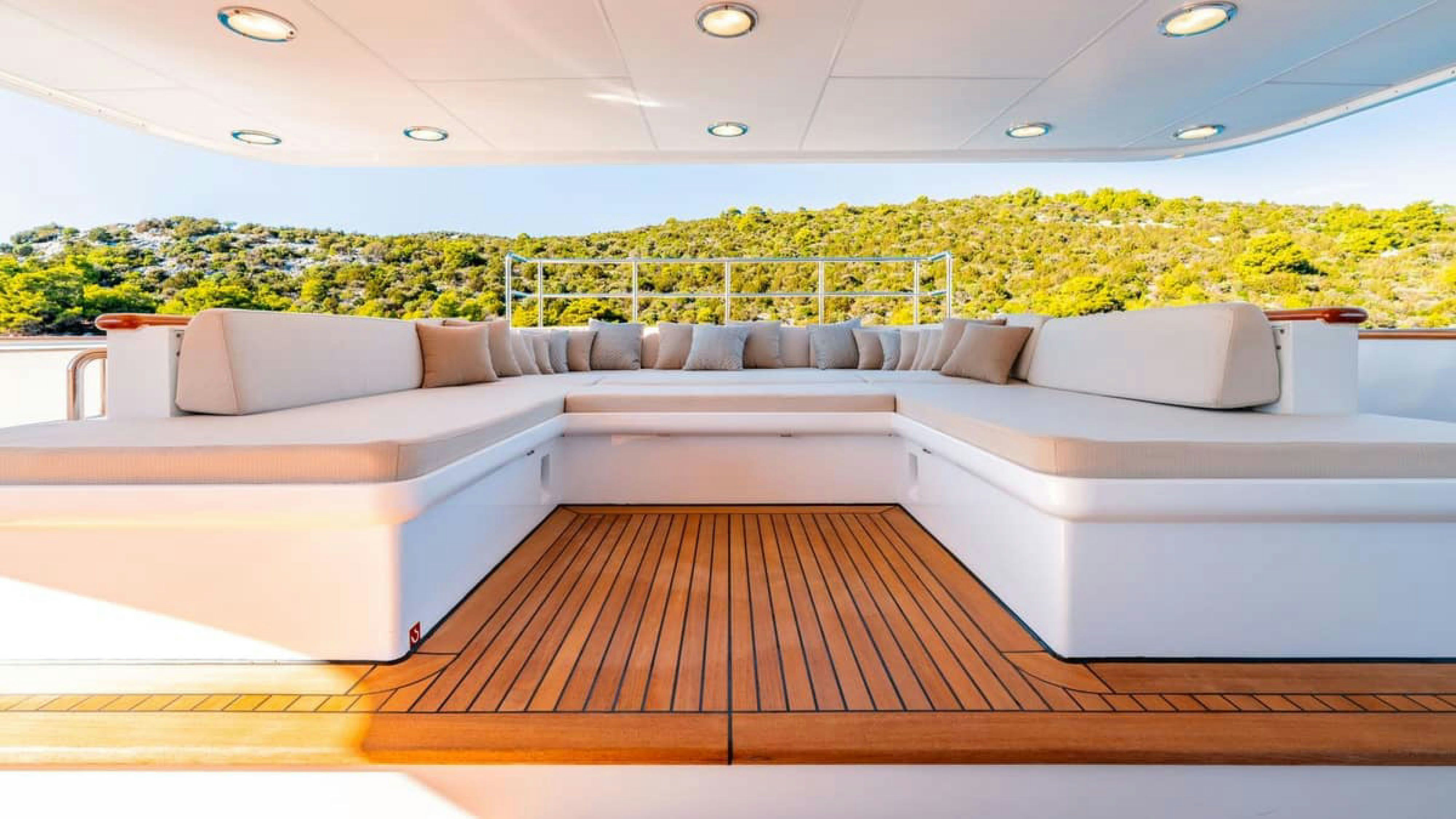 a couch and a table in a room aboard VICTORY Yacht for Charter