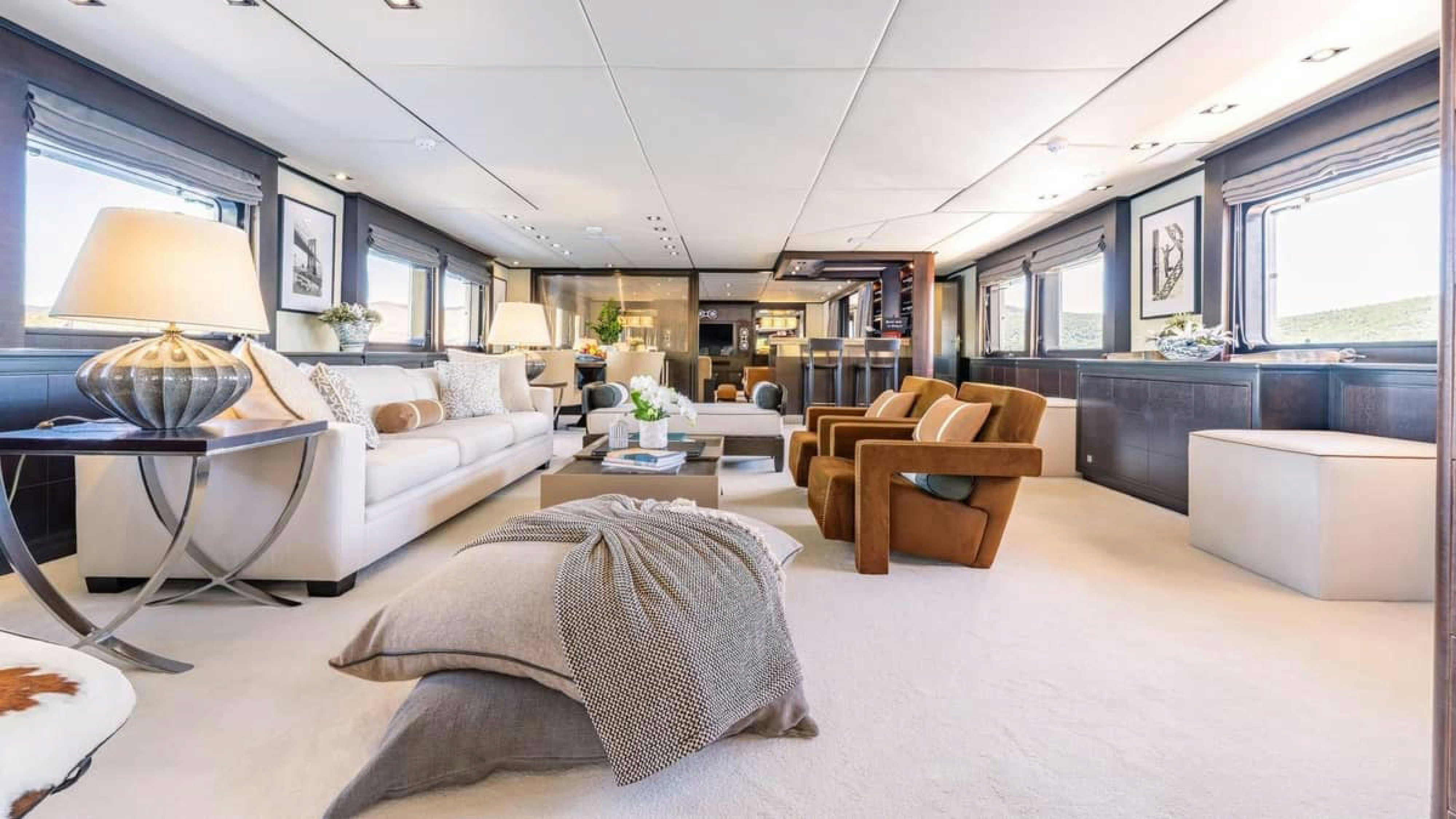 a living room with a large window aboard VICTORY Yacht for Charter