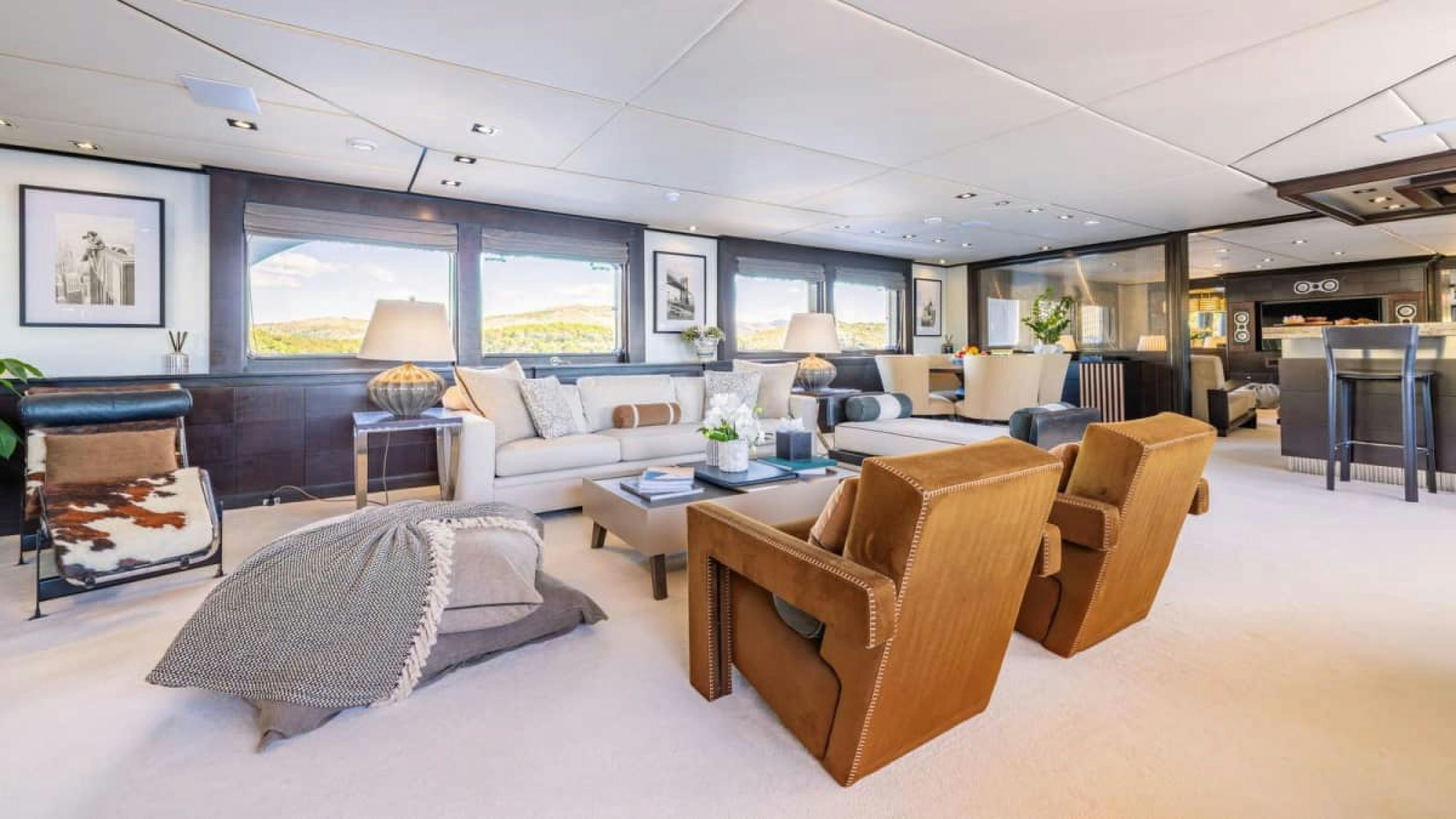 a living room with a large window aboard VICTORY Yacht for Charter