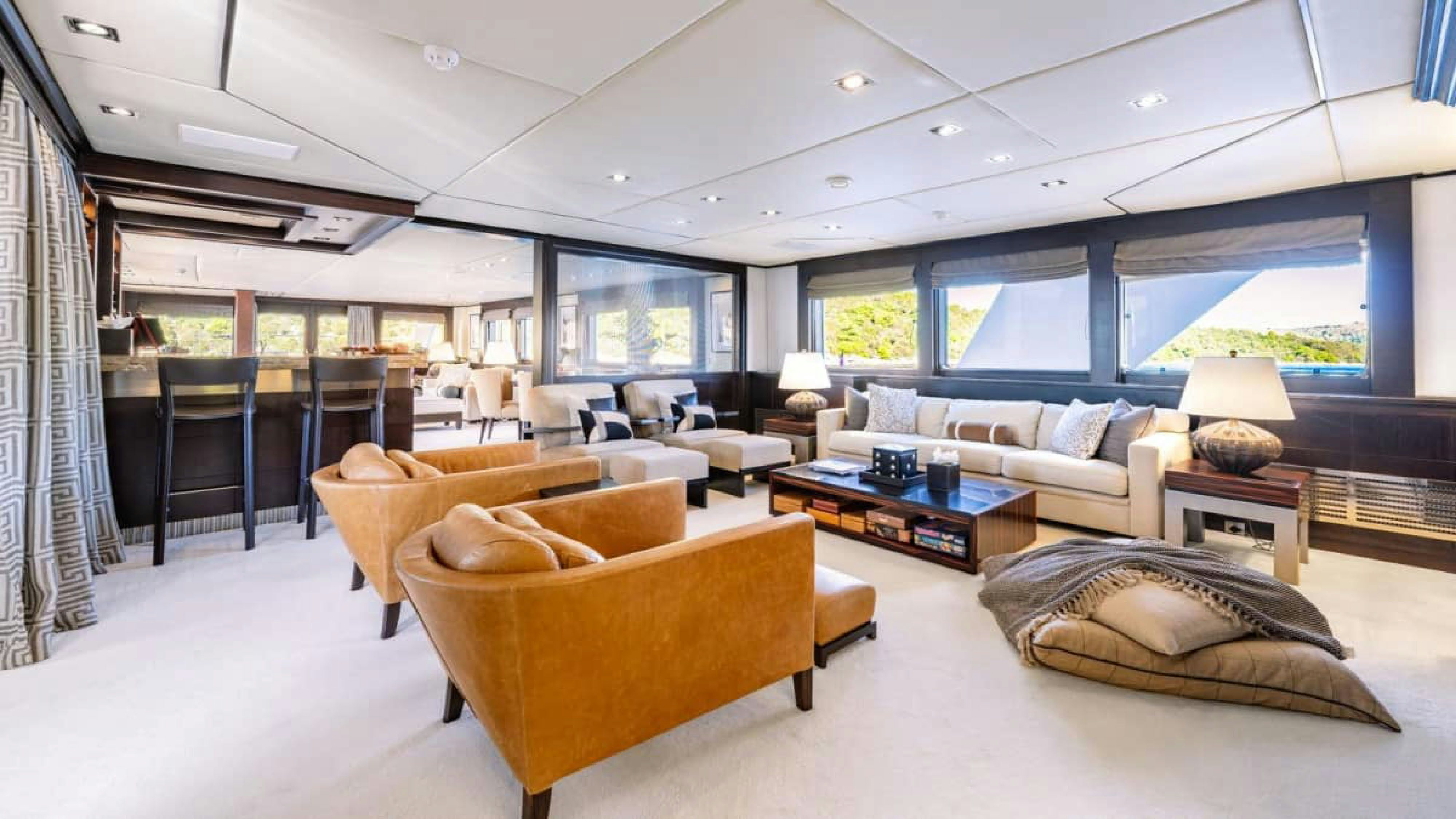 a living room with a large window aboard VICTORY Yacht for Charter