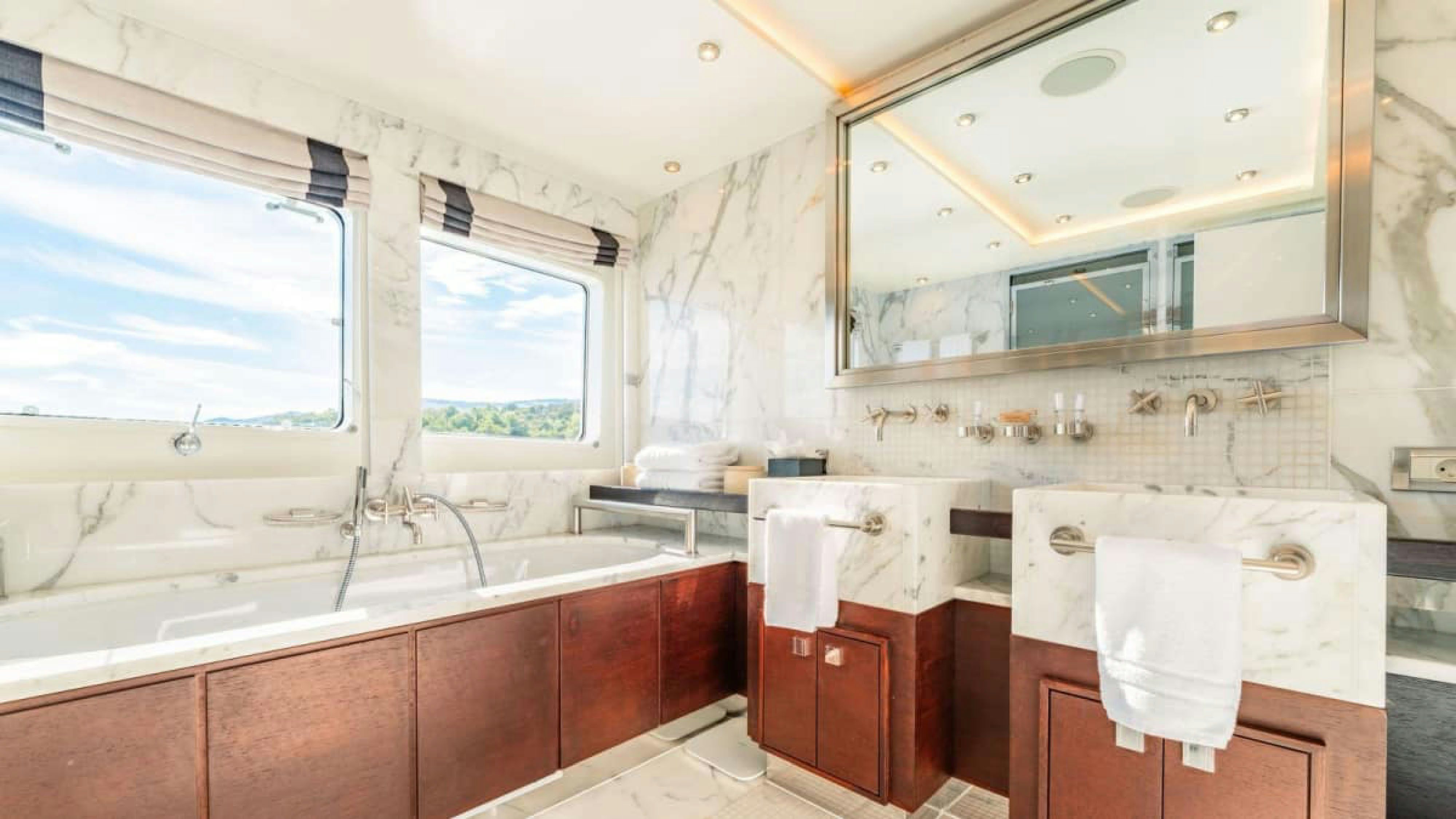 a bathroom with a large bathtub aboard VICTORY Yacht for Charter