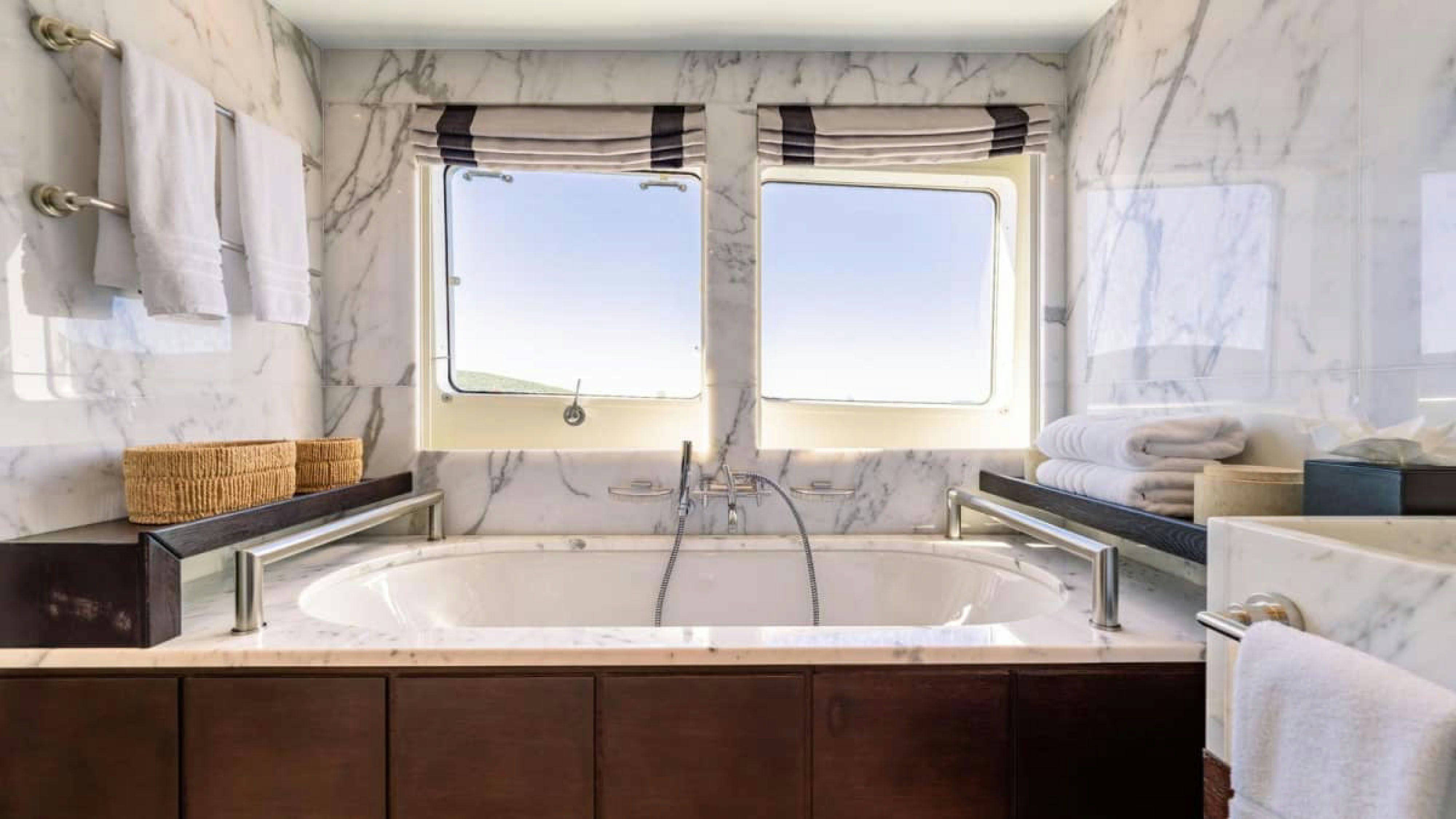 a bathroom with a sink and a window aboard VICTORY Yacht for Charter