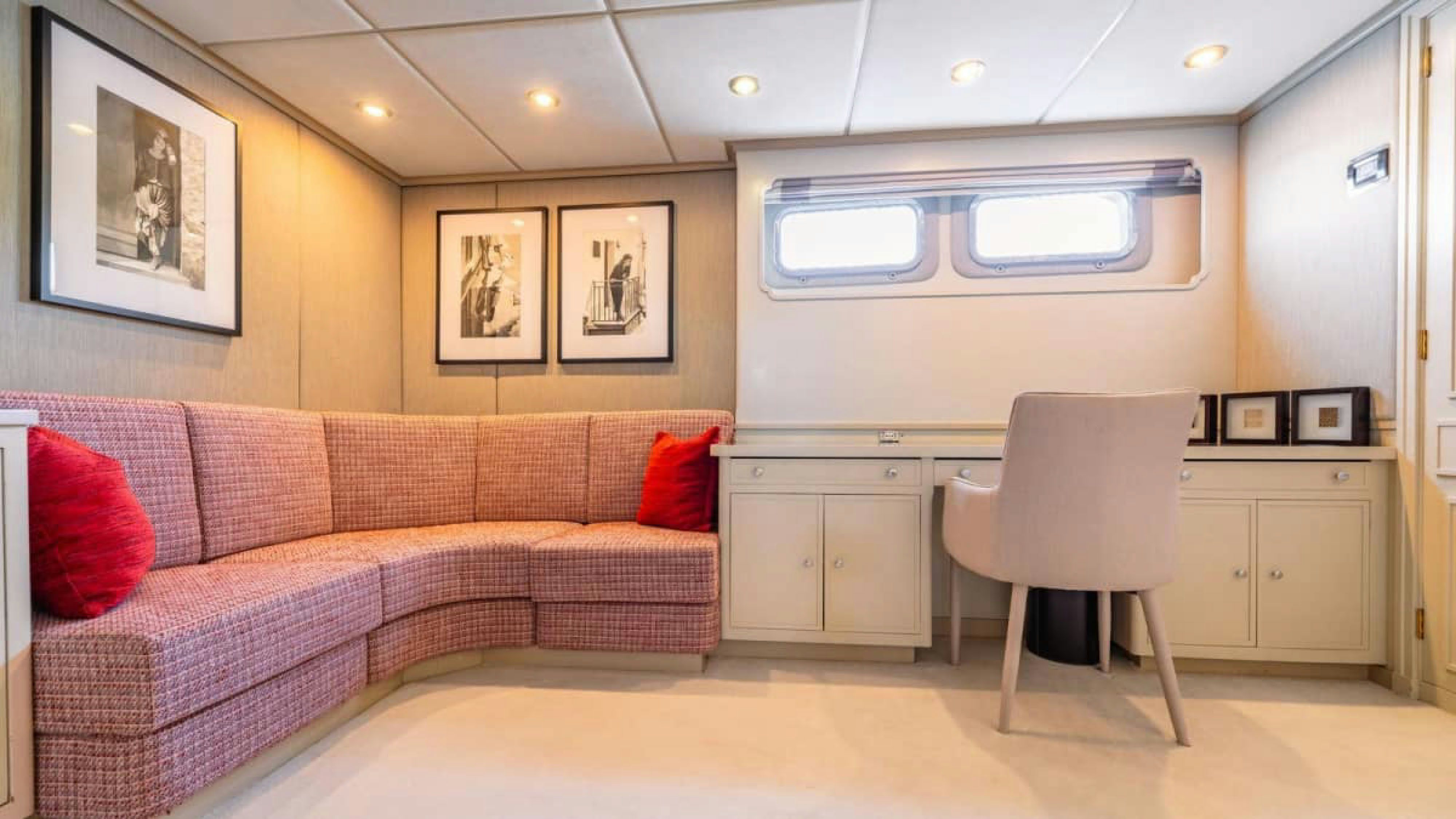 a living room with a couch and a chair aboard VICTORY Yacht for Charter