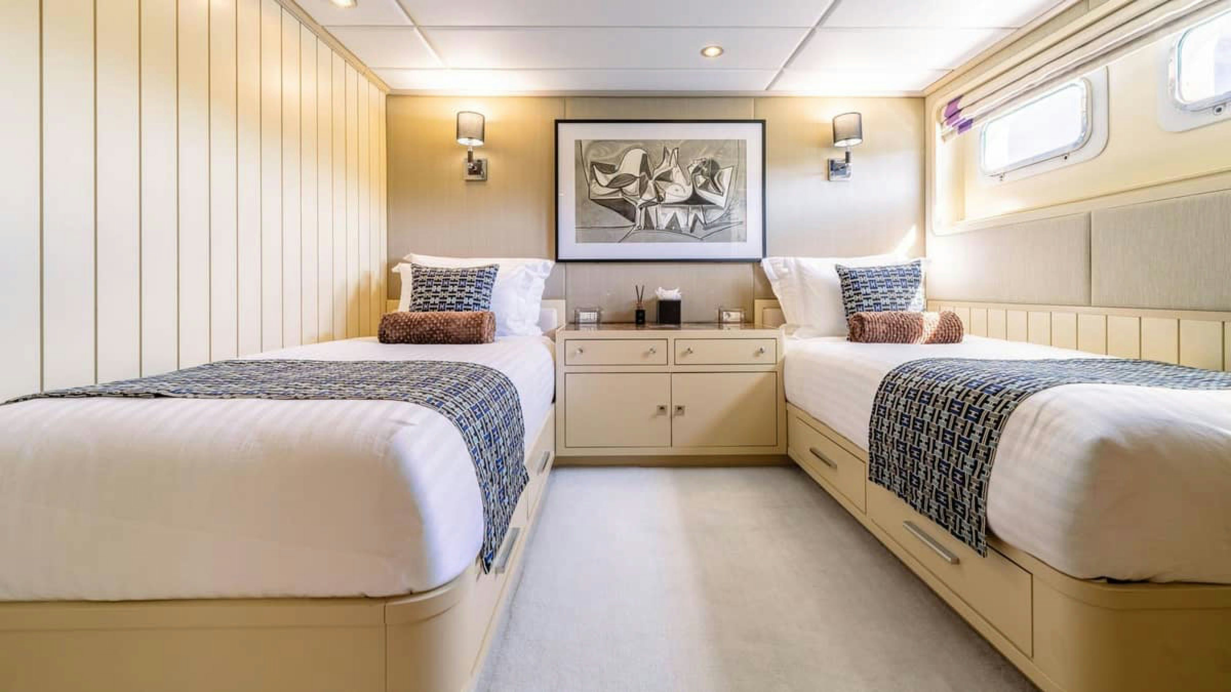 a room with two beds aboard VICTORY Yacht for Charter