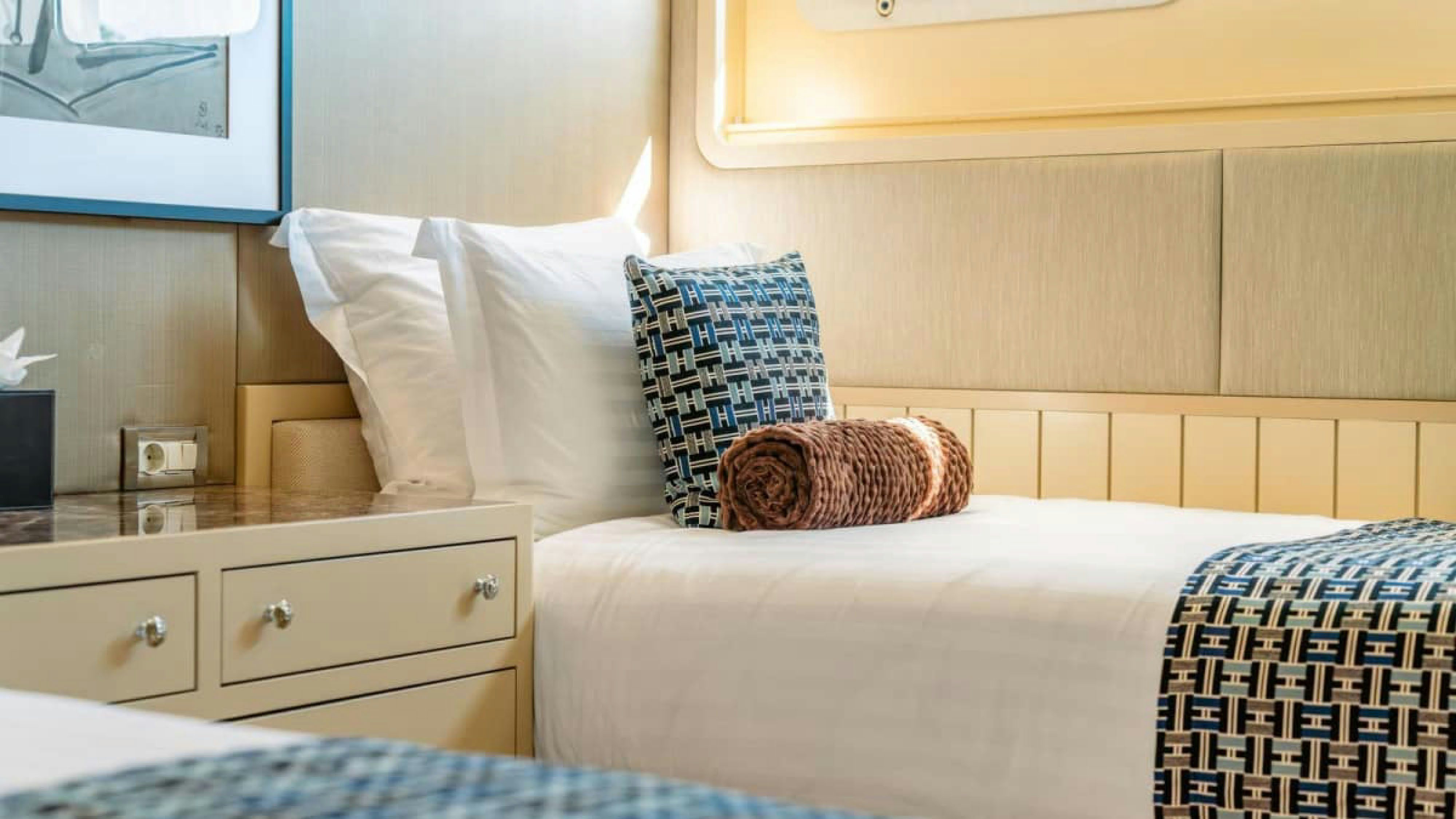 a bed with white sheets aboard VICTORY Yacht for Charter