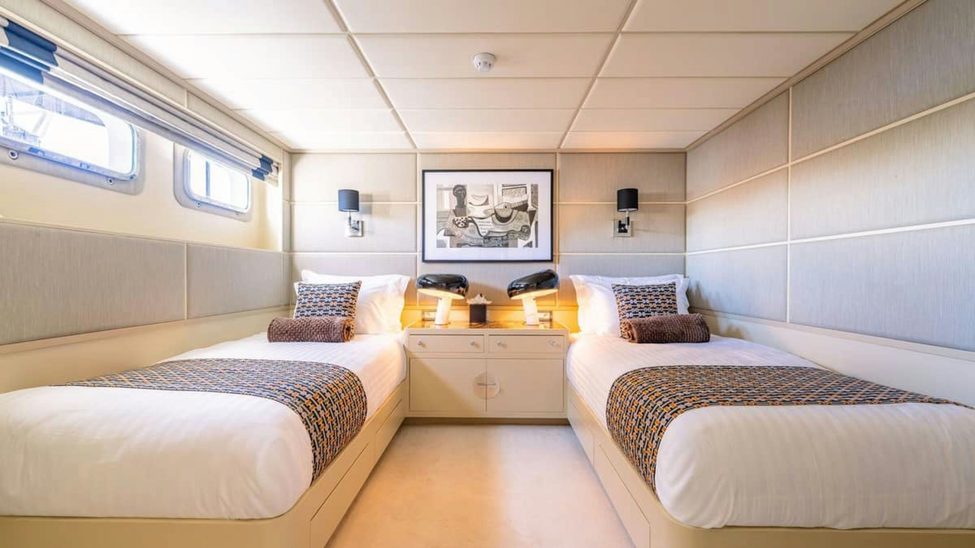 a room with two beds aboard VICTORY Yacht for Charter