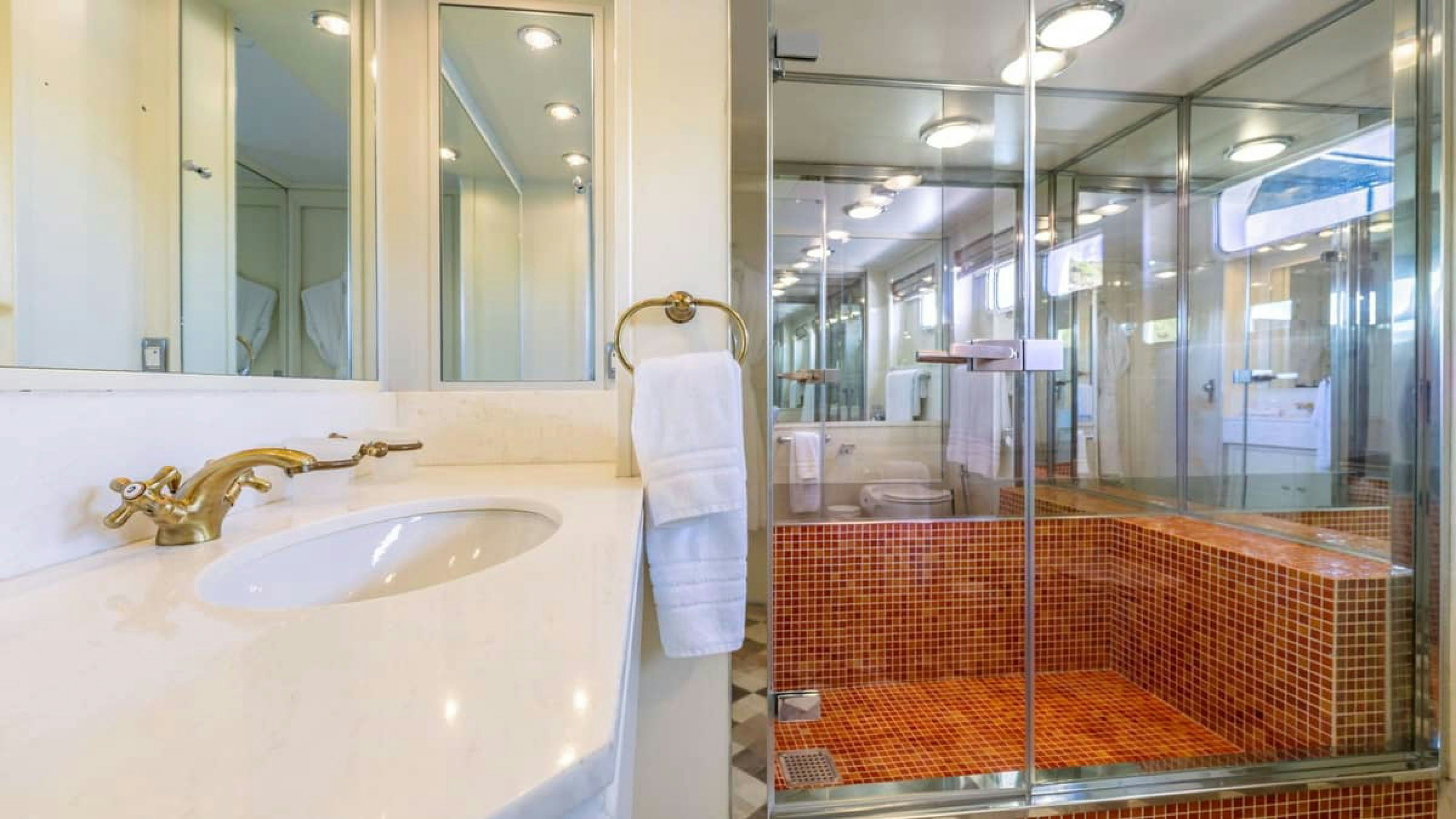 a bathroom with a sink and a mirror aboard VICTORY Yacht for Charter