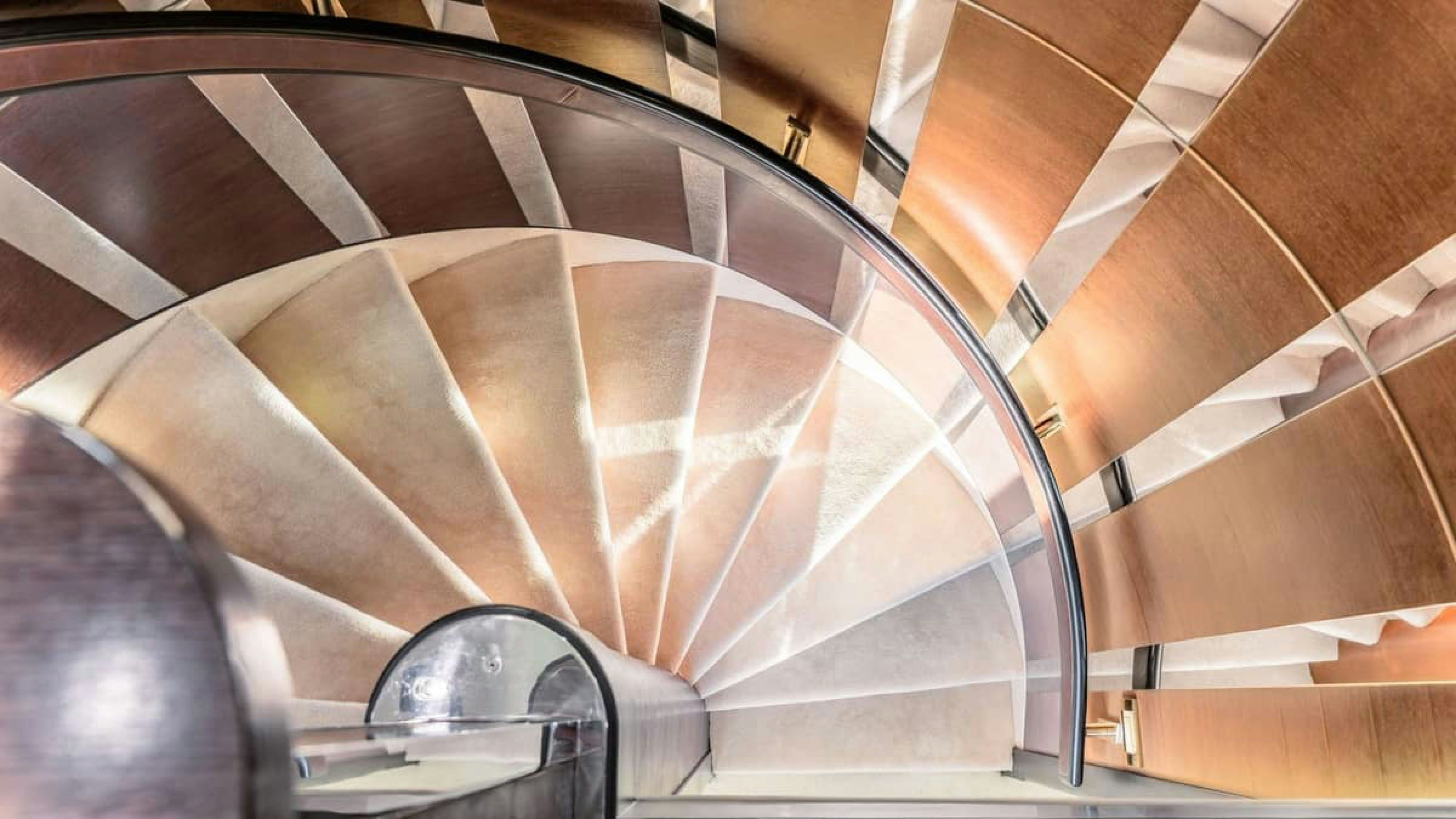 a wooden staircase with a glass window aboard VICTORY Yacht for Charter