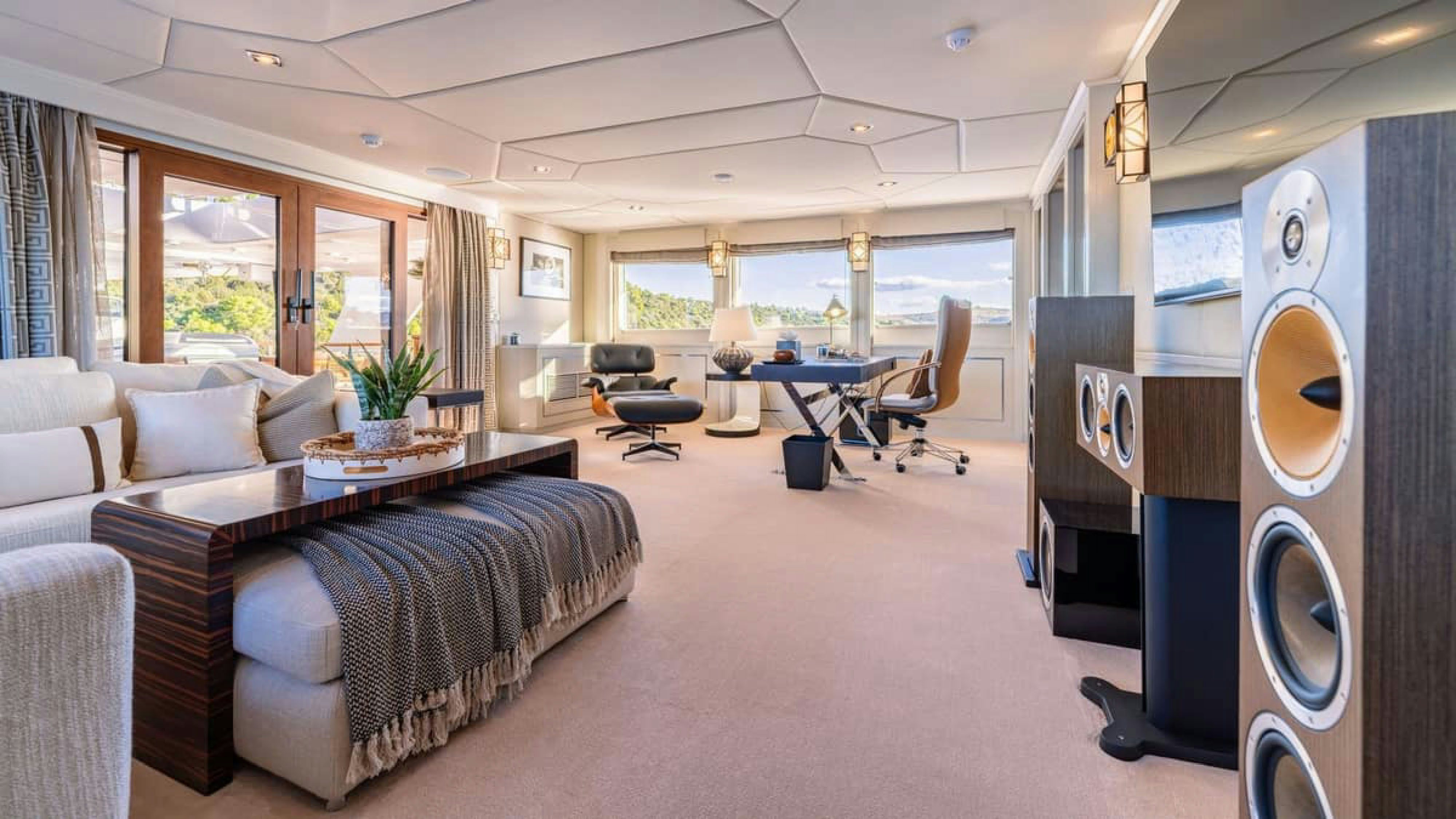 a living room with a couch and a tv aboard VICTORY Yacht for Charter