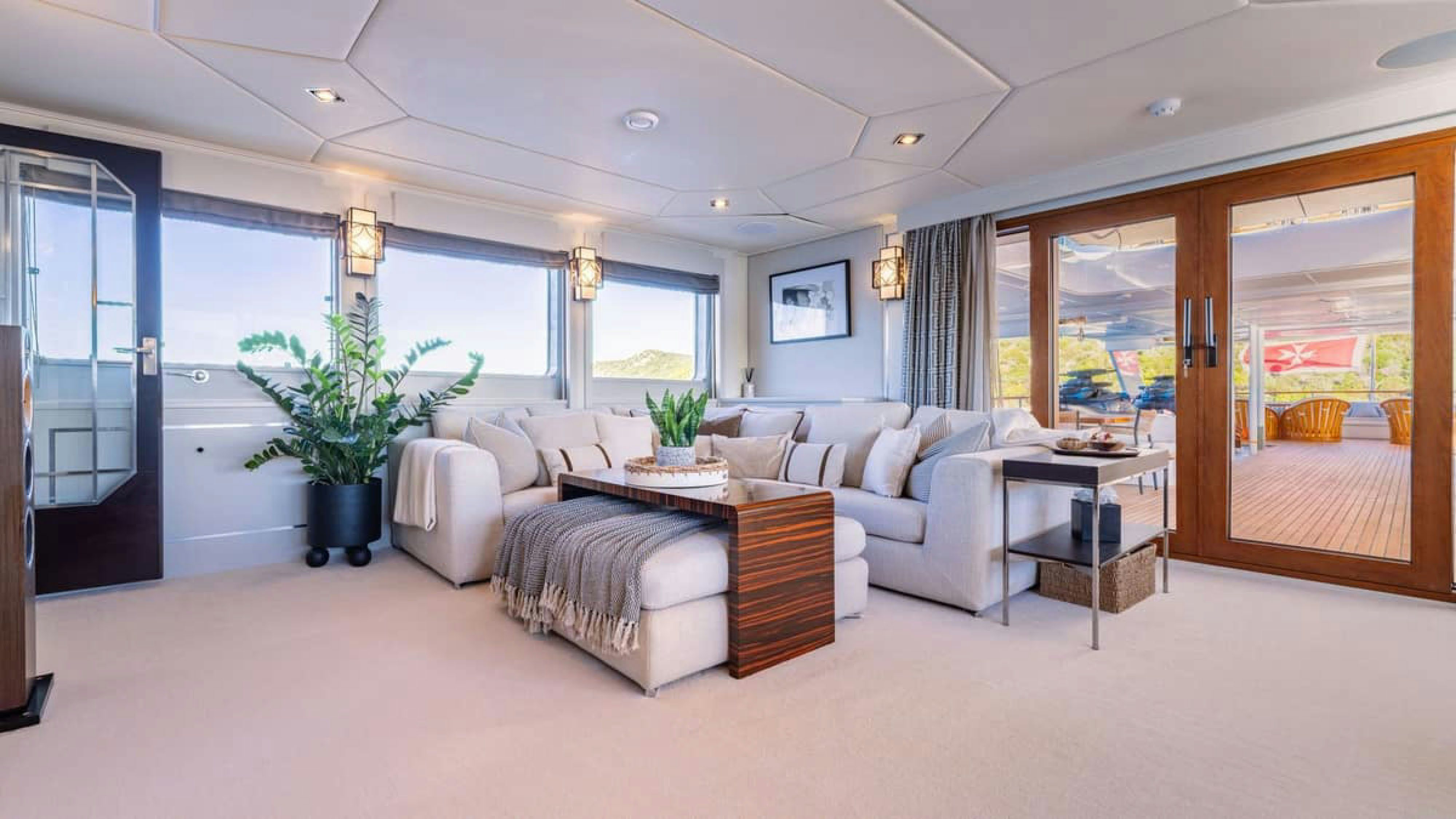 a living room with a large window aboard VICTORY Yacht for Charter
