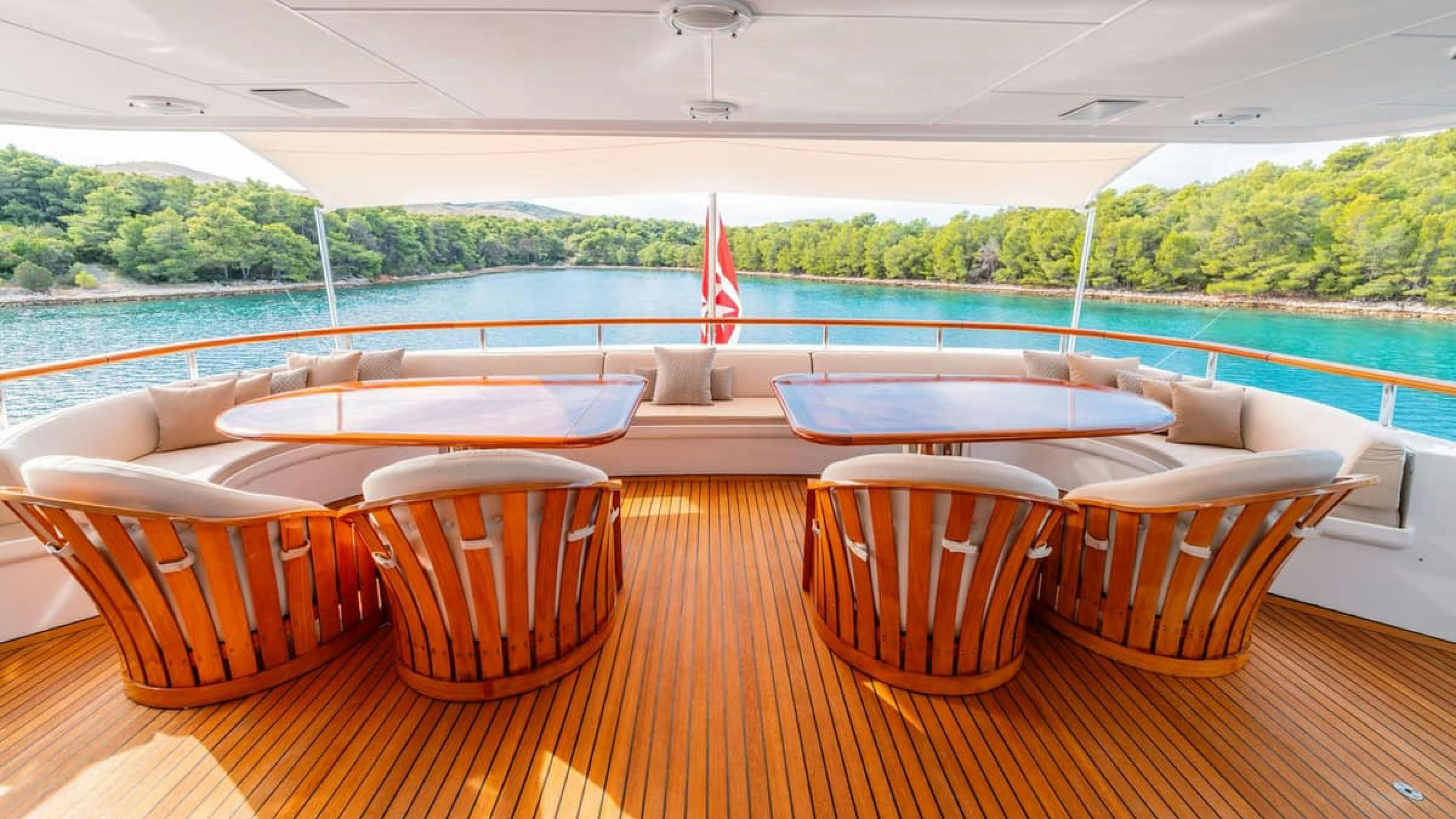 a table with chairs on it aboard VICTORY Yacht for Charter