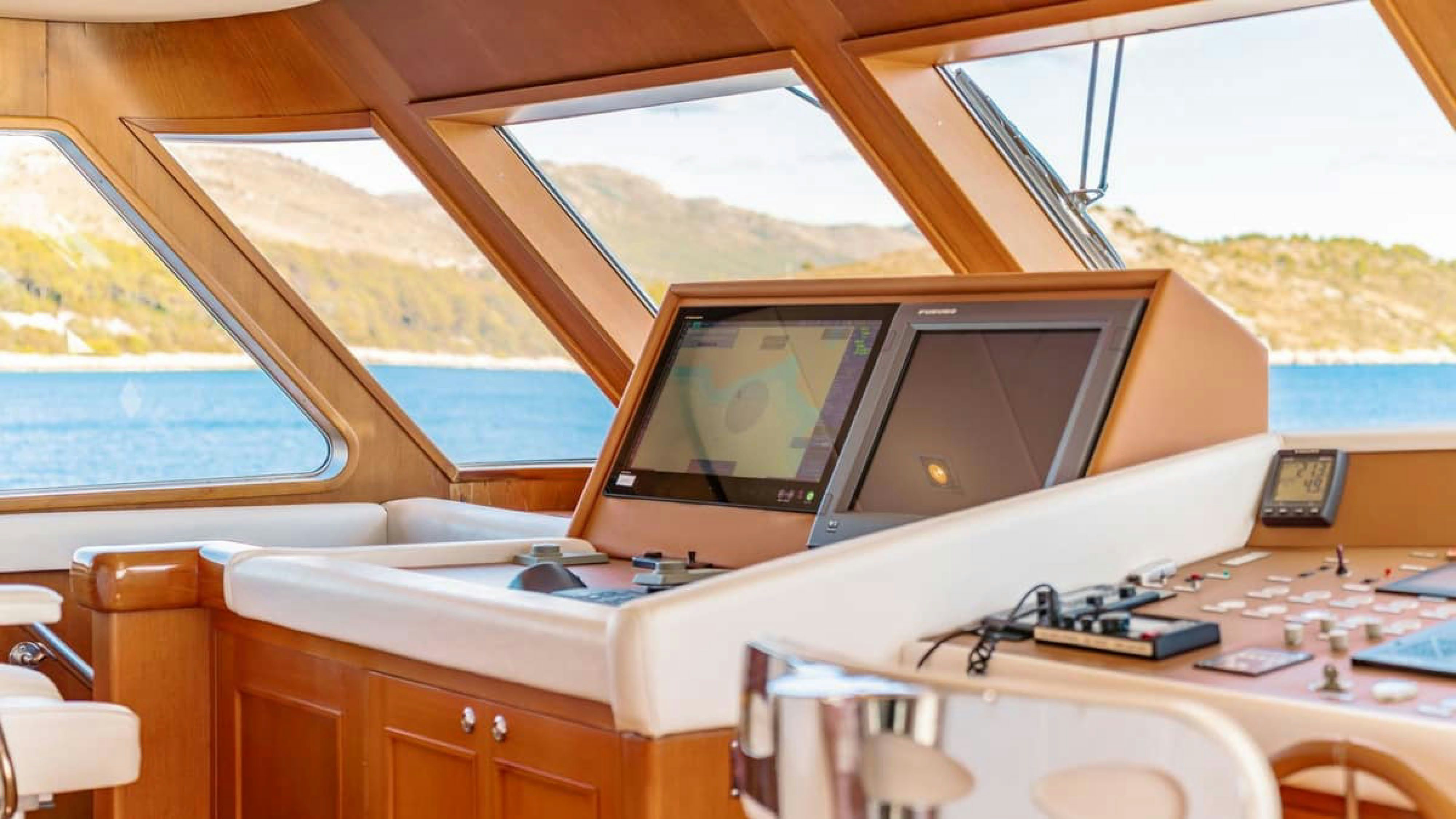 a laptop on a table aboard VICTORY Yacht for Charter