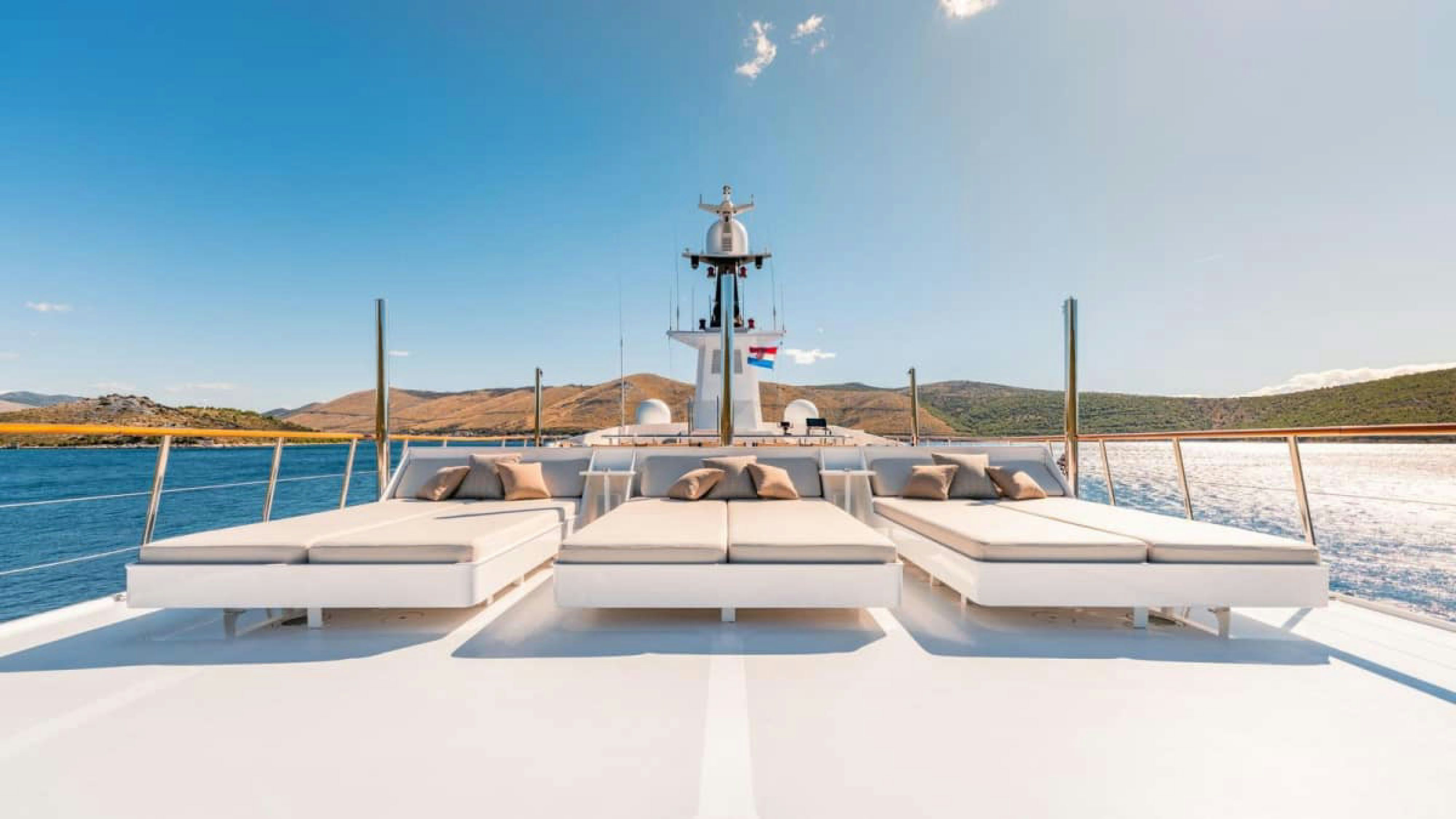 a white boat on a dock aboard VICTORY Yacht for Charter