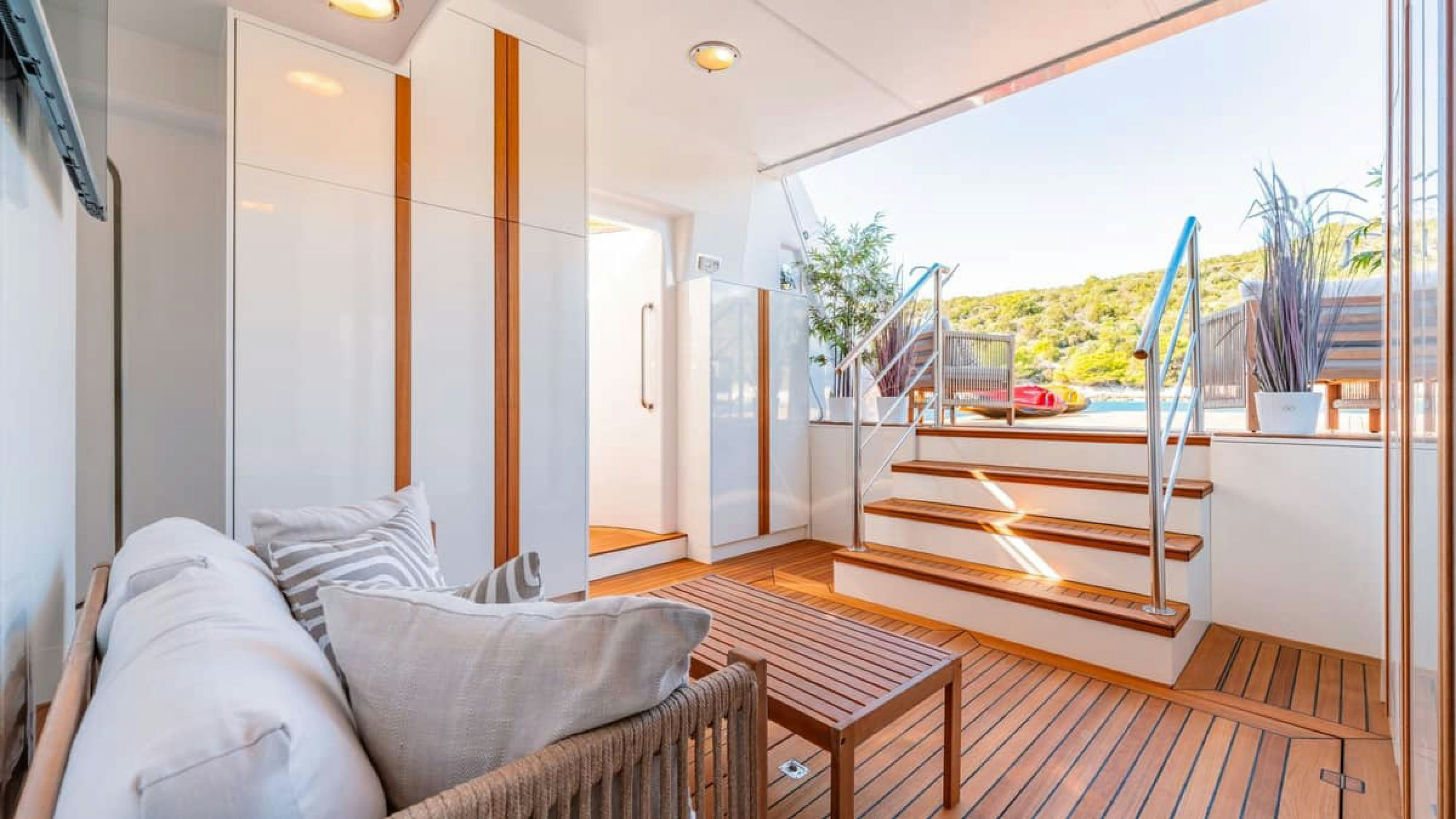 a room with a bed and a table aboard VICTORY Yacht for Charter