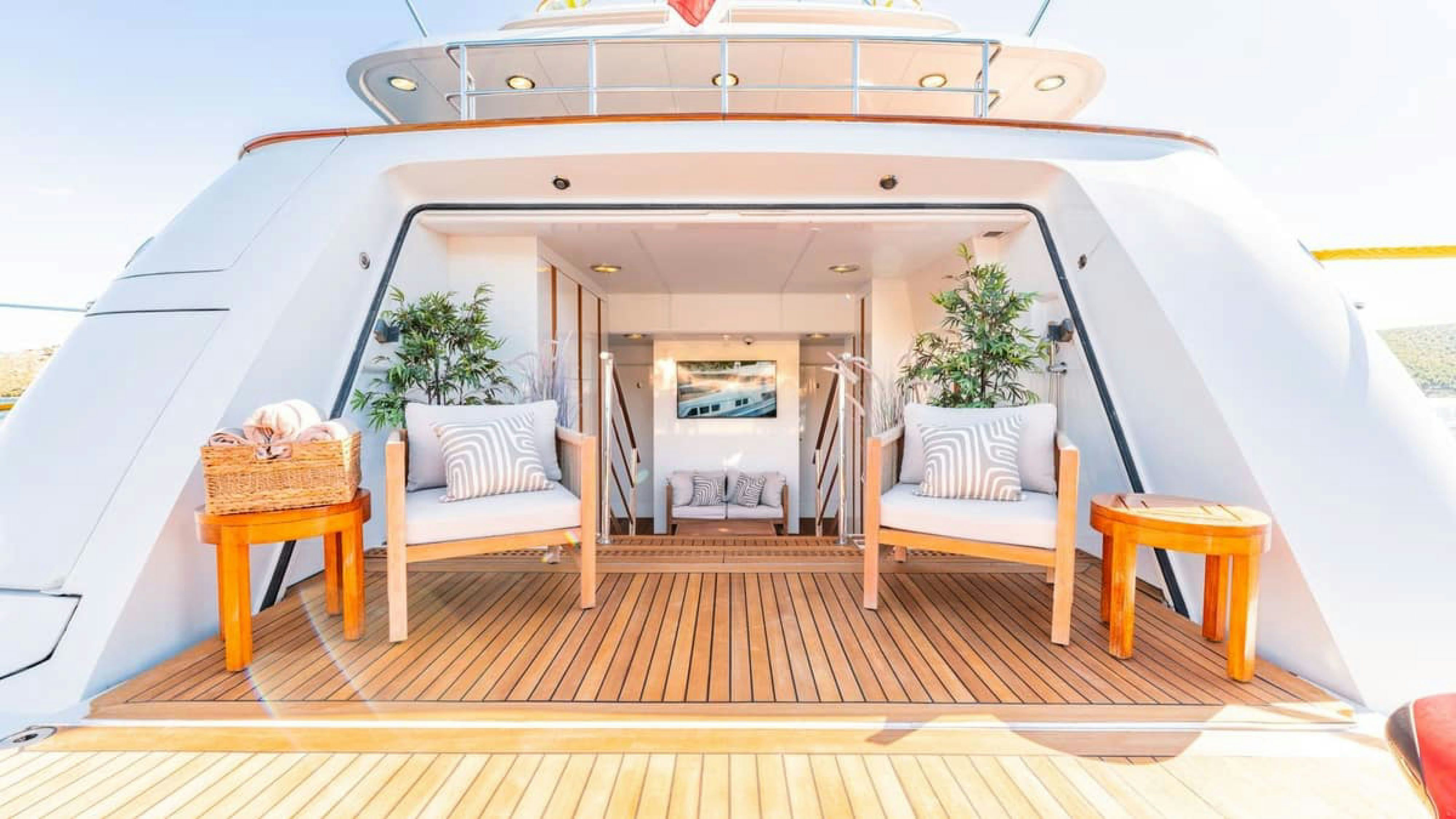 a room with a bed and a table aboard VICTORY Yacht for Charter