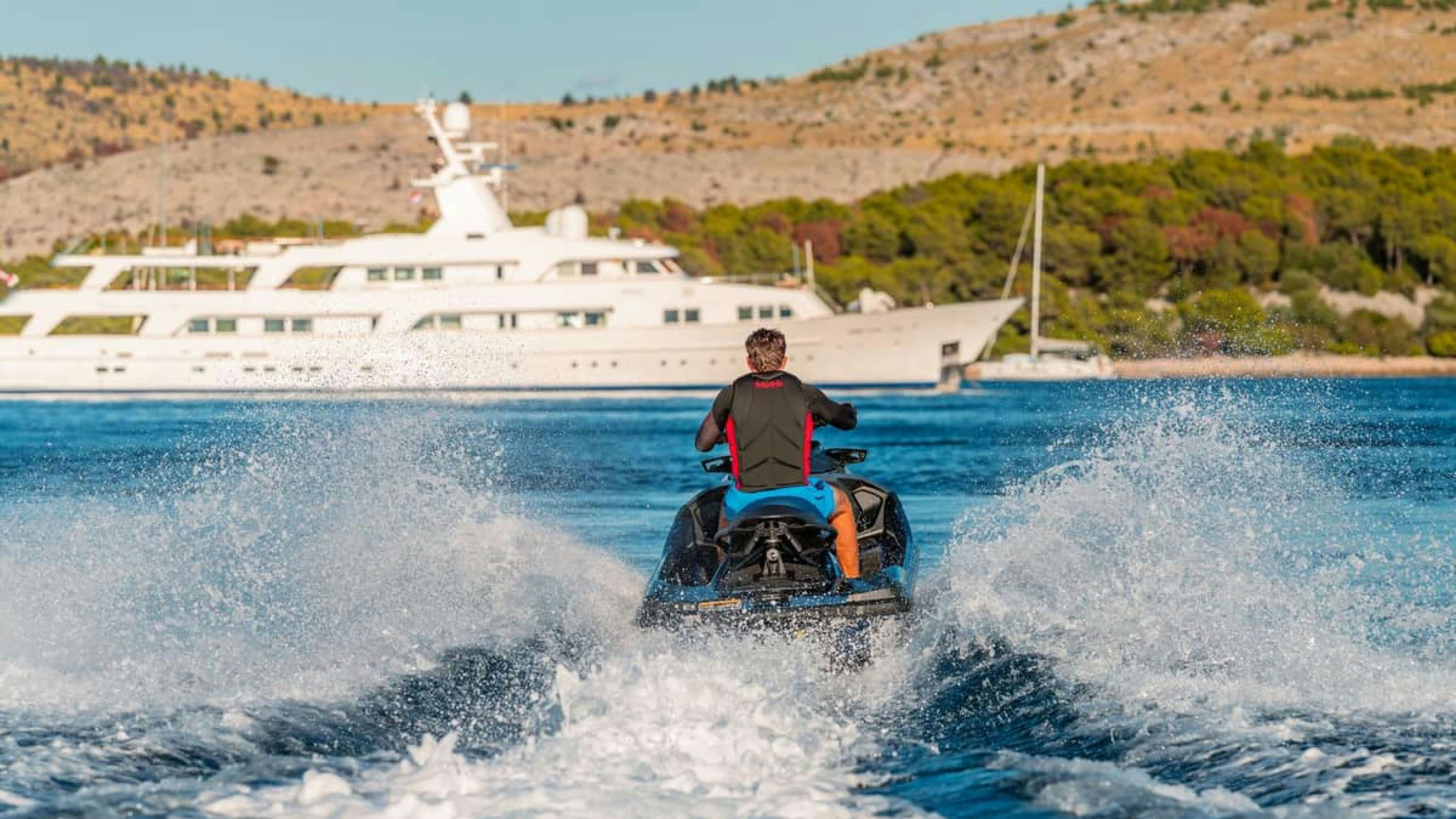 a man on a jet ski aboard VICTORY Yacht for Charter