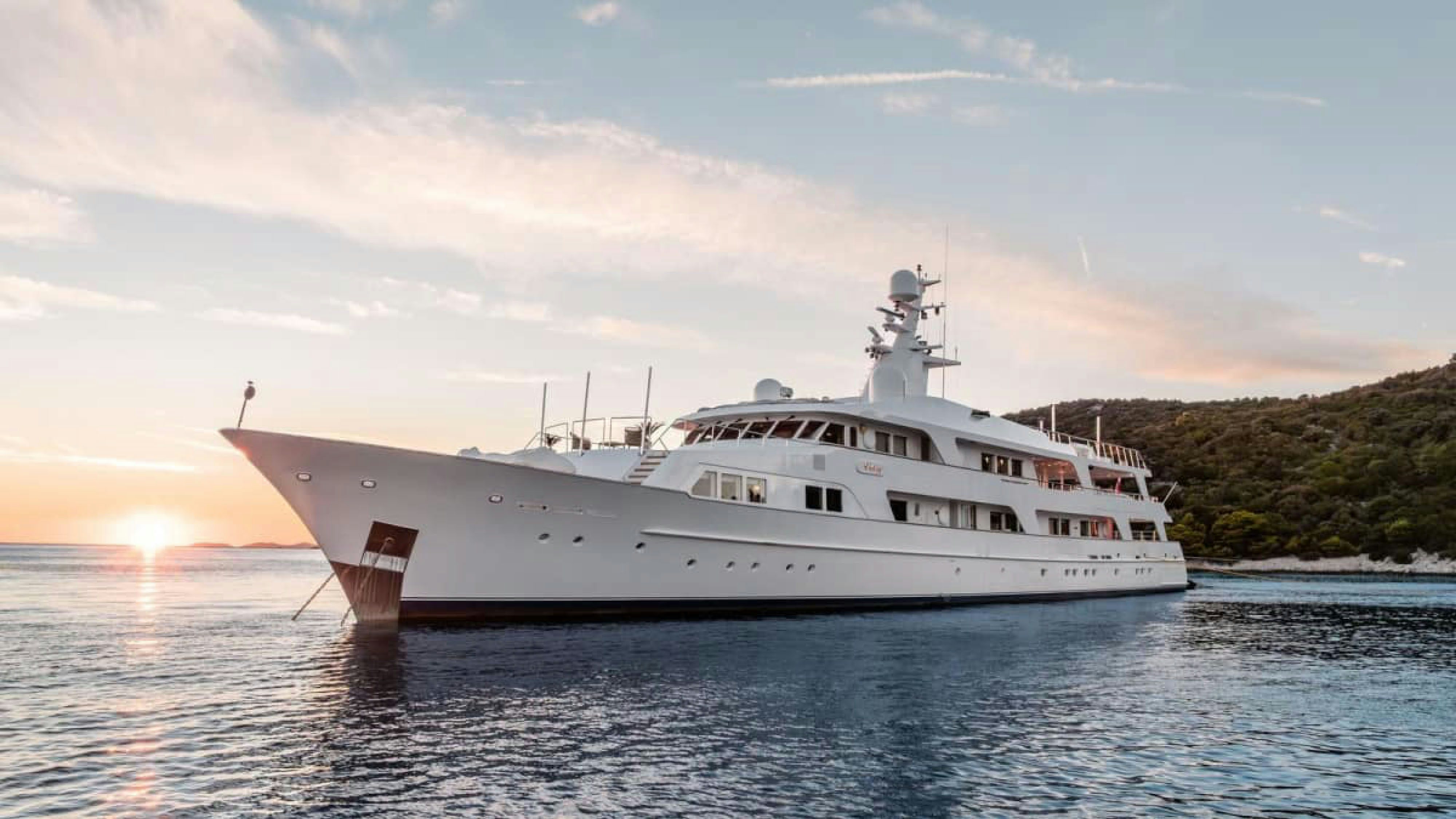 a large white ship in the water aboard VICTORY Yacht for Charter