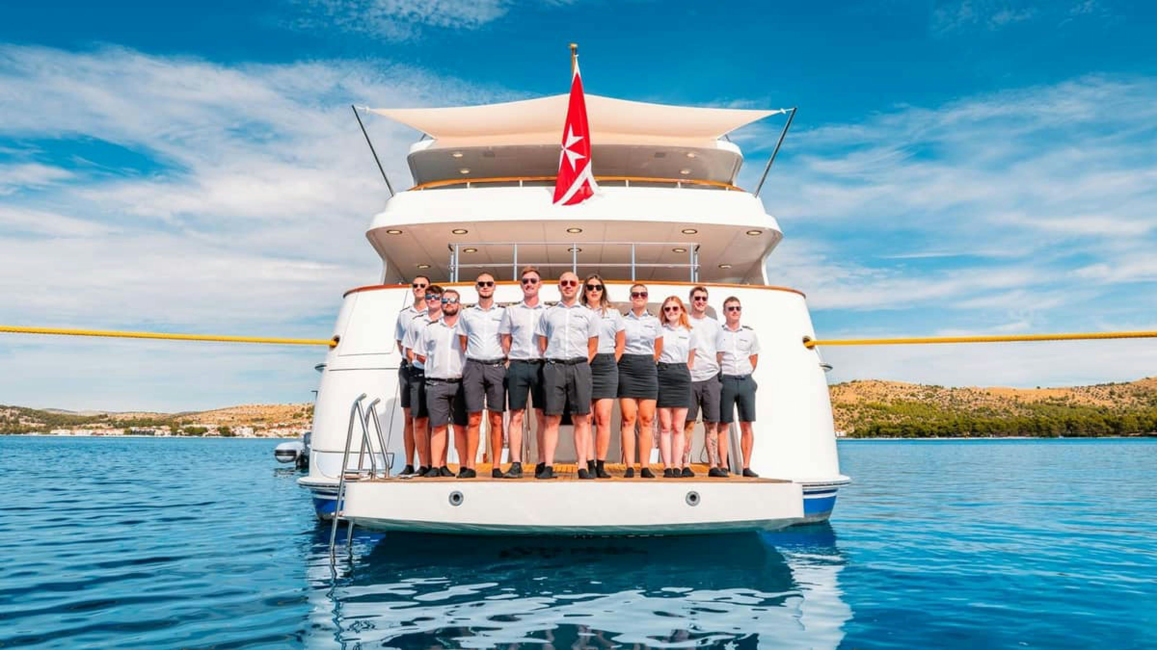 a group of people on a boat aboard VICTORY Yacht for Charter